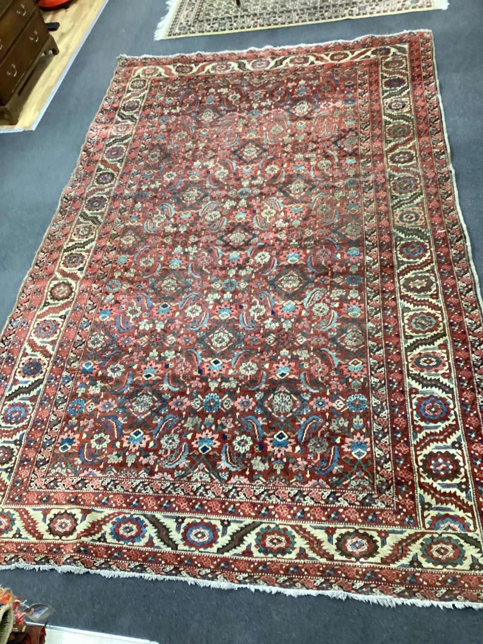 A North West Persian brick red ground carpet, 340 x 216cm                                                                                                                                                                   