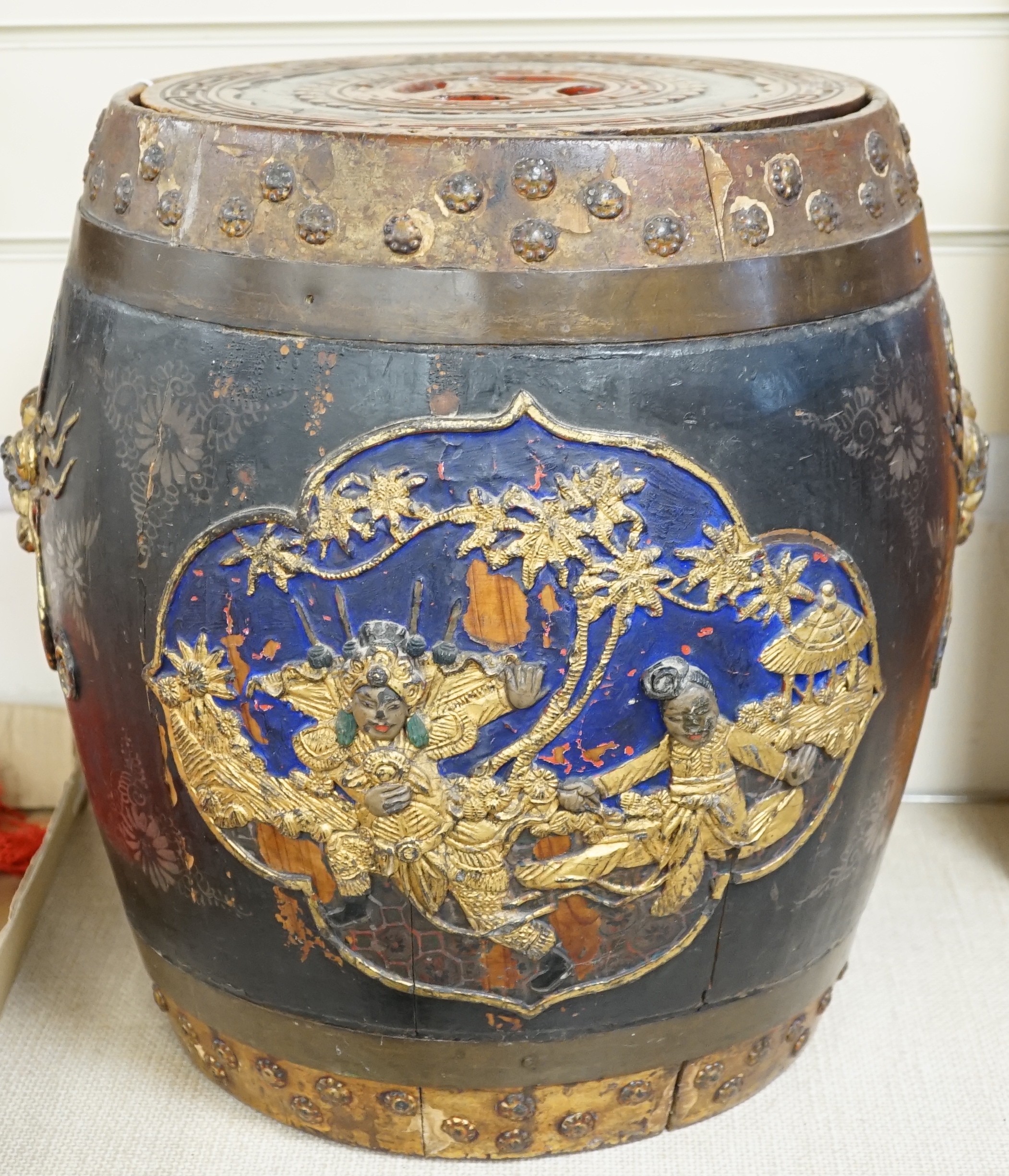 A Chinese lacquer decorated wood barrel form seat/storage container, 40cms high                                                                                                                                             