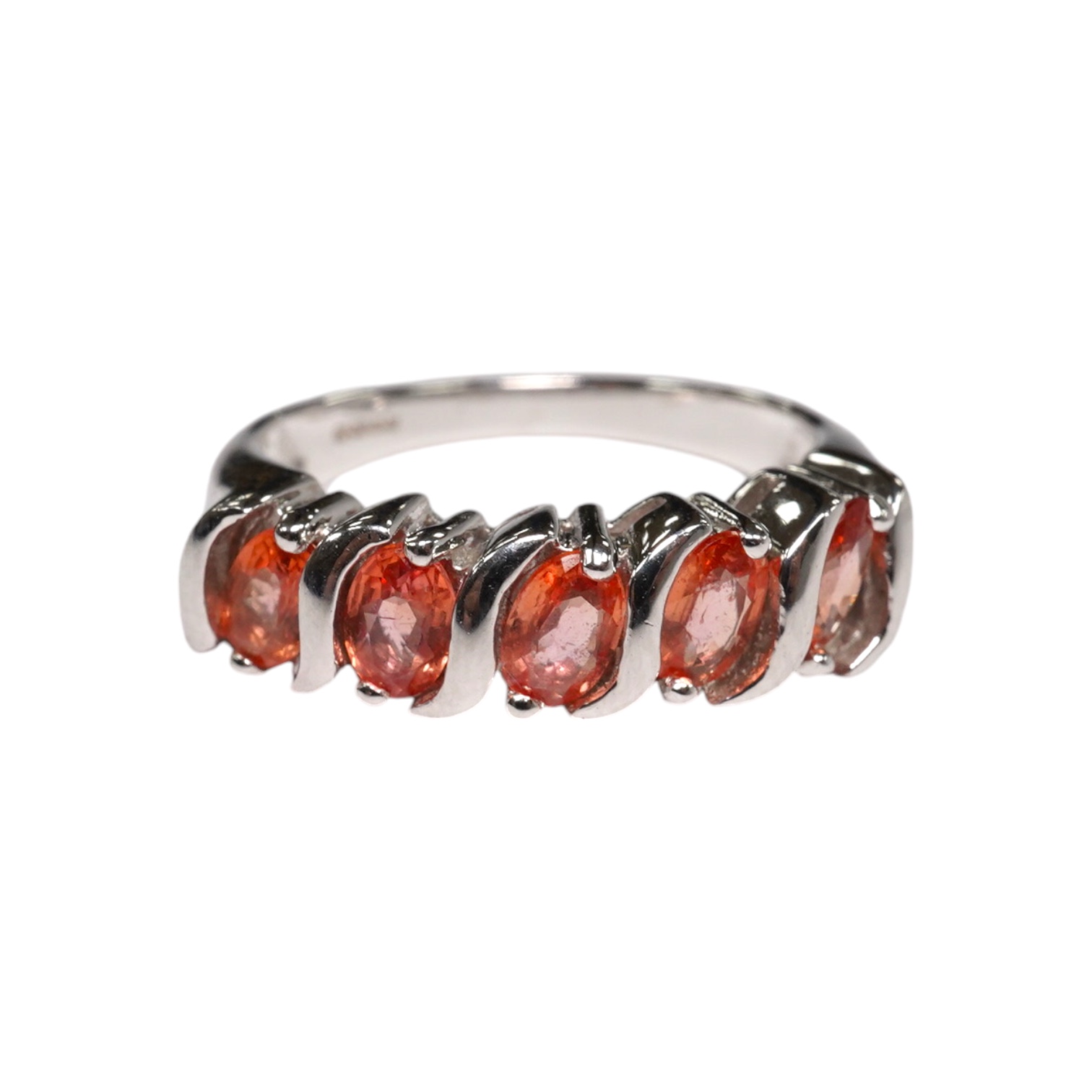 A modern 18ct white gold and five stone orange/pink stone set half hoop ring, size M/N, gross weight 5.6 grams. Condition - fair to good                                                                                    