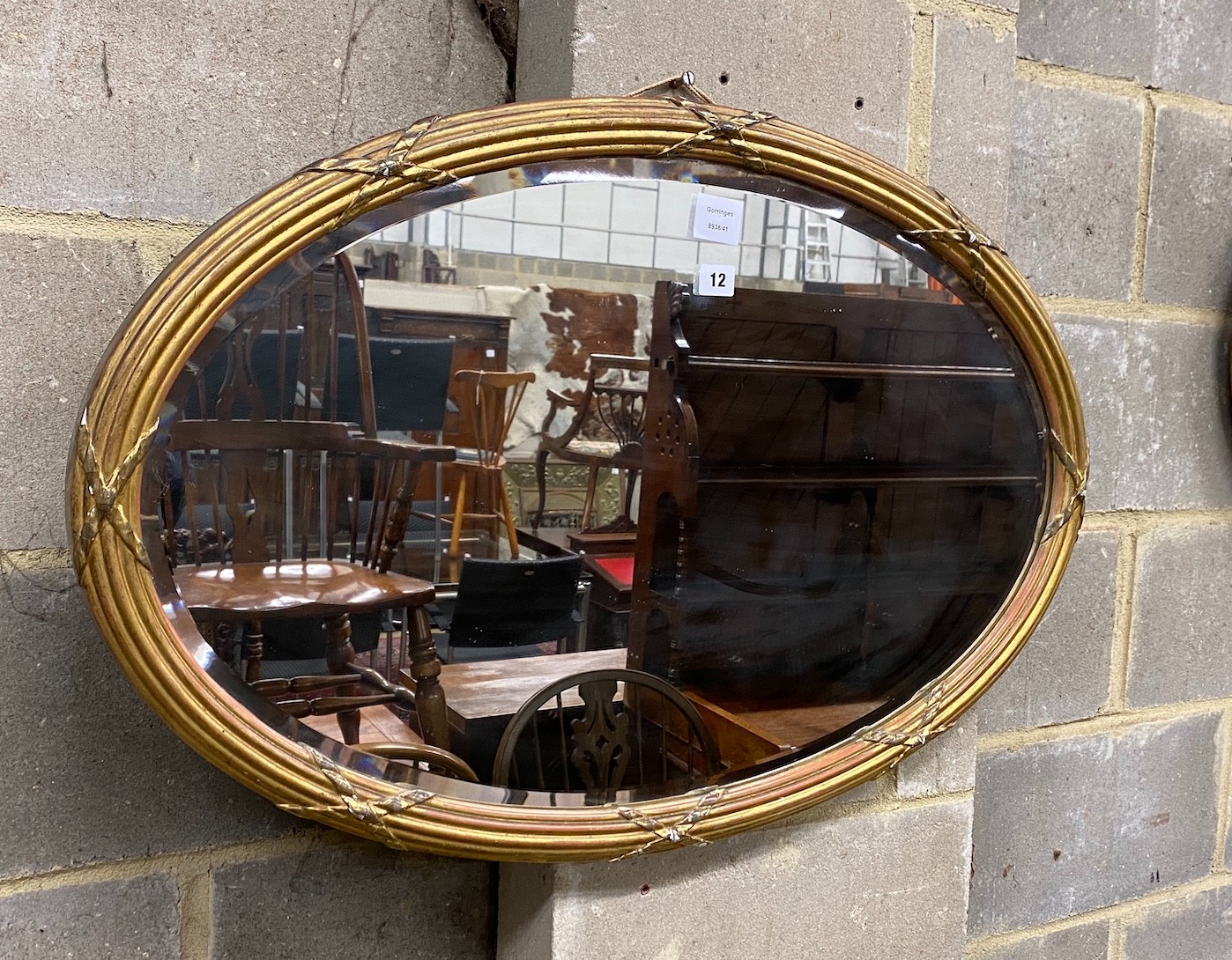 An Edwardian oval giltwood and composition wall mirror, width 86cm, height 56cm                                                                                                                                             