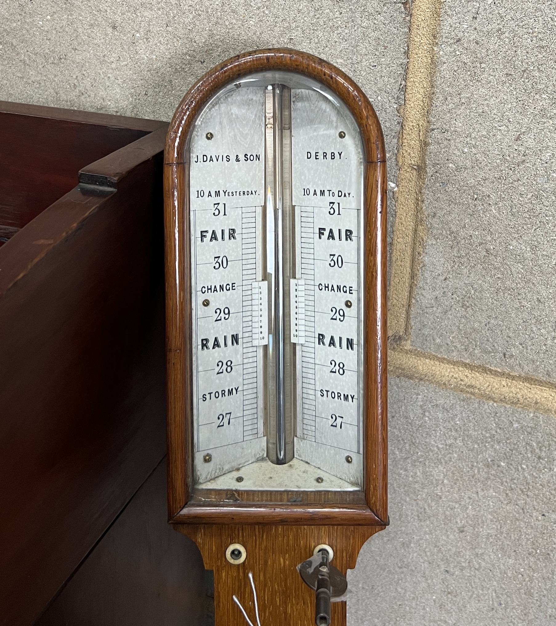 A Victorian oak stick barometer and thermometer, marked Davis & Son, Derby, height 93cm                                                                                                                                     