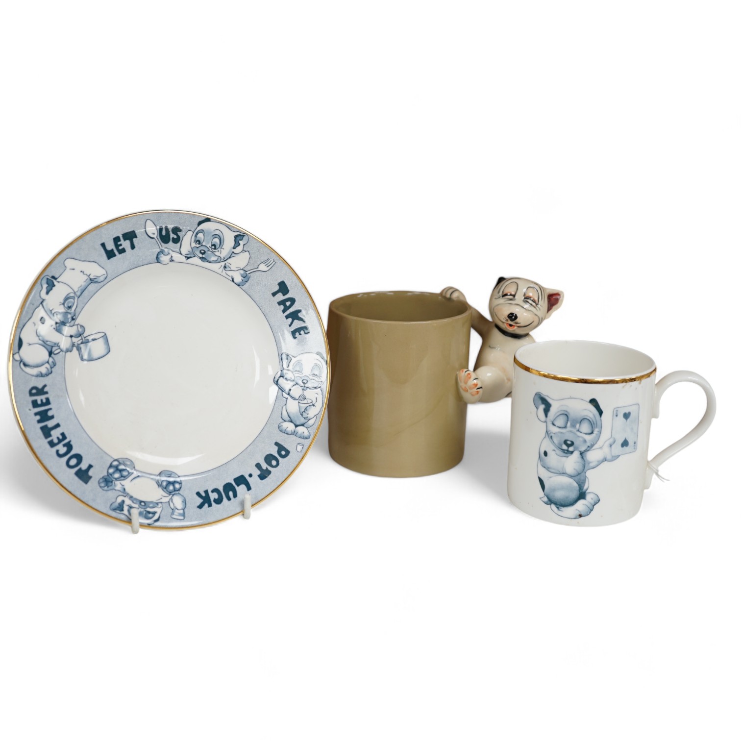 A Richard Dennis Bonzo Dog mug and matching plate and a Dennis China glazed pottery mug, plate 17cm diameter (3). Condition - slight chip to base edge of plate                                                             