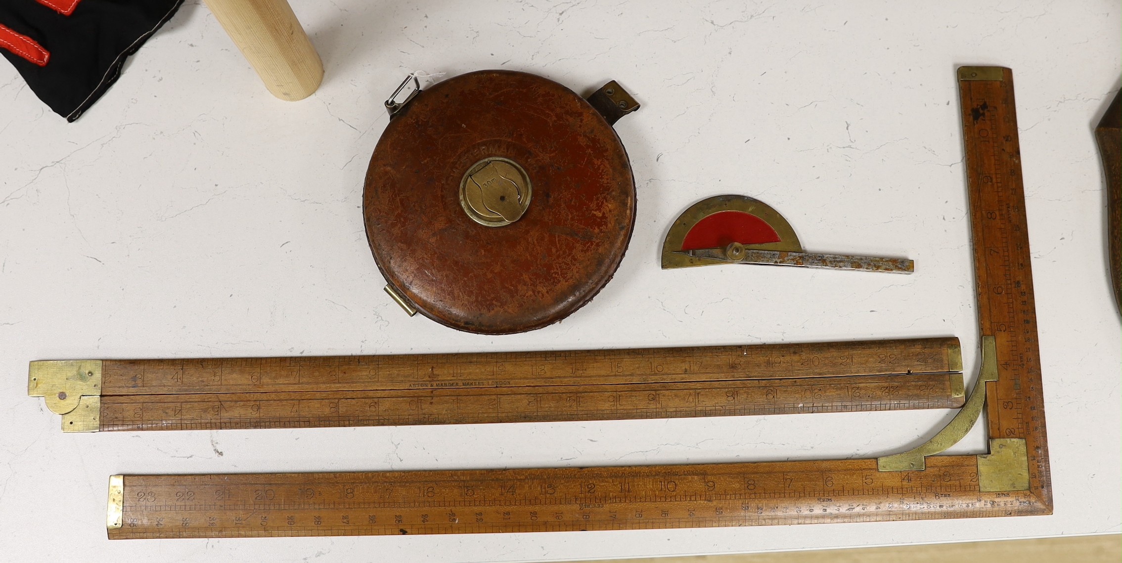 Two Aston & Mander rulers, a Chesterman tape measure and a protractor                                                                                                                                                       