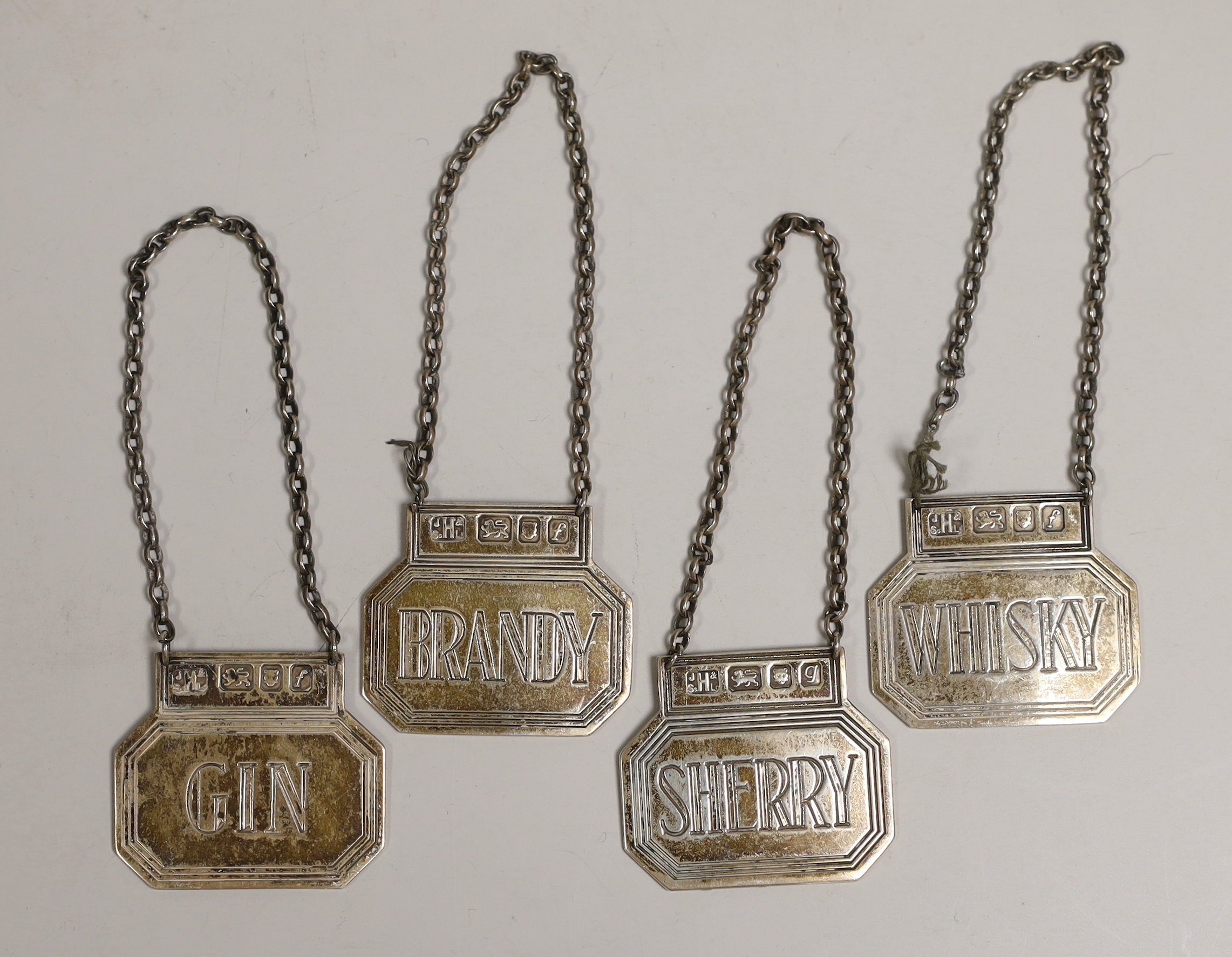 A set of four modern silver wine labels, John Harvey & Sons Ltd, London, 1961/2, 43mm.                                                                                                                                      