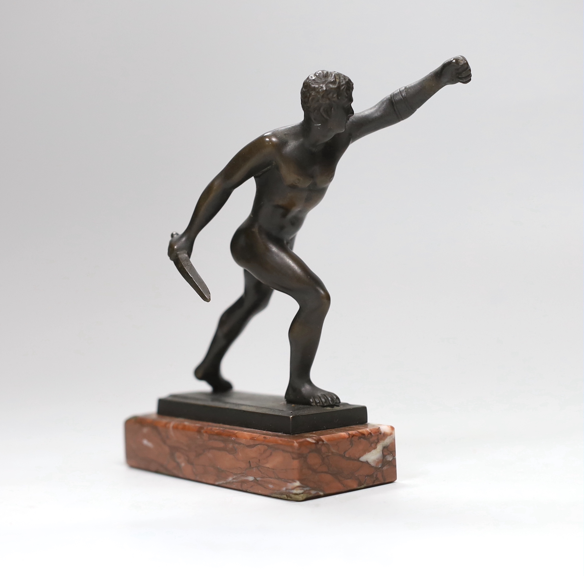 A bronze Borghese gladiator after the antique, on rouge marble plinth, 13.5cm high x 10cm wide                                                                                                                              