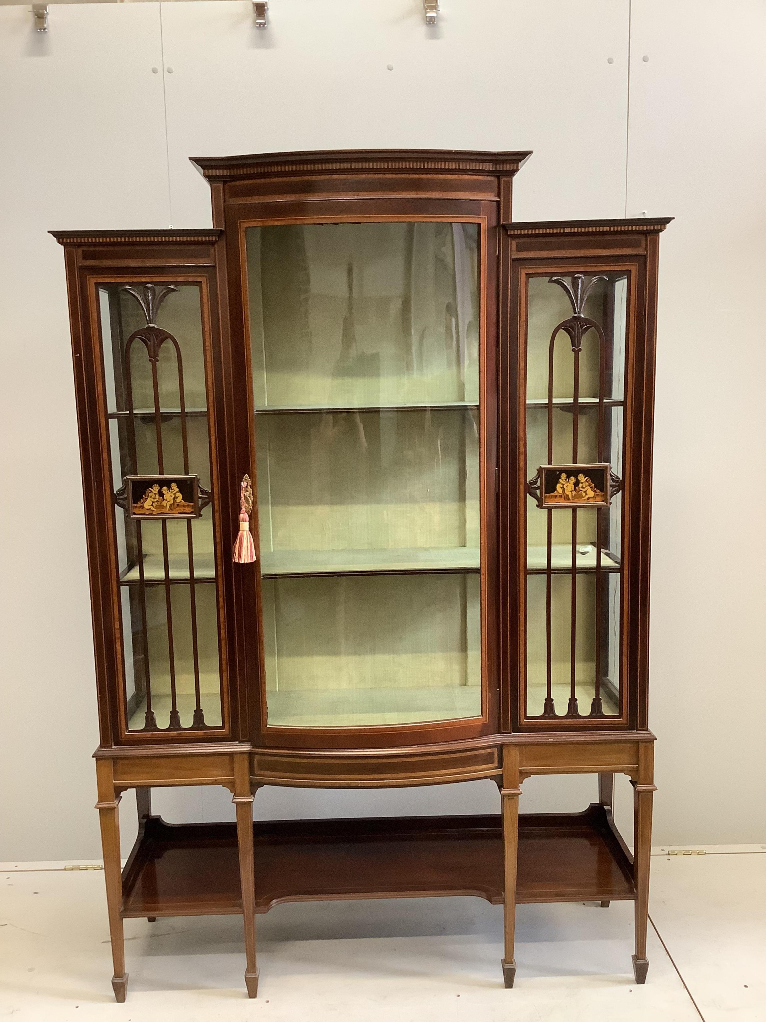 An Edwardian inlaid and satinwood crossbanded mahogany bow front display cabinet, width 126cm, depth 42cm, height 185cm. Condition - good                                                                                   