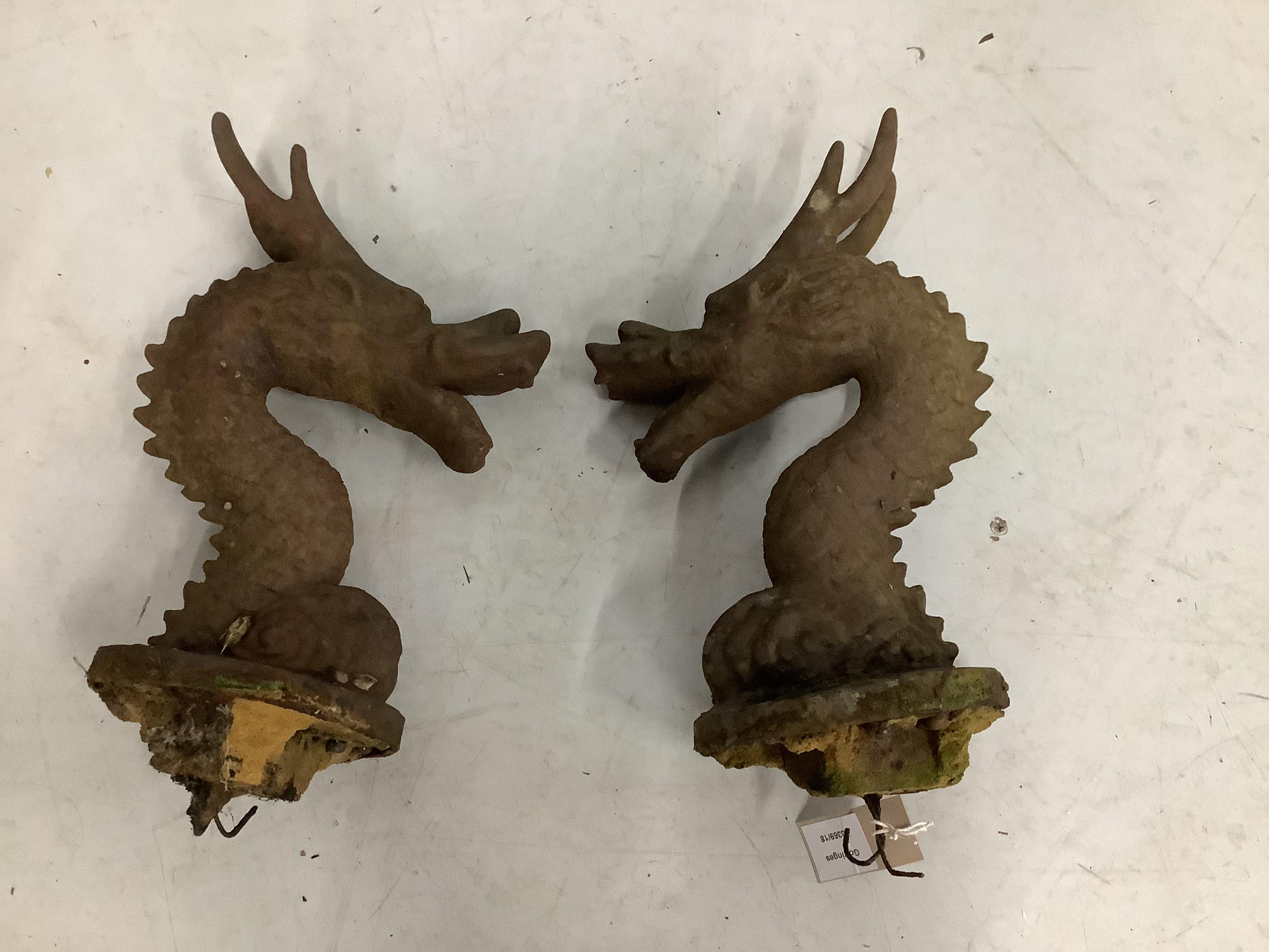 A pair of Victorian cast iron dragon head finials, height 36cm                                                                                                                                                              