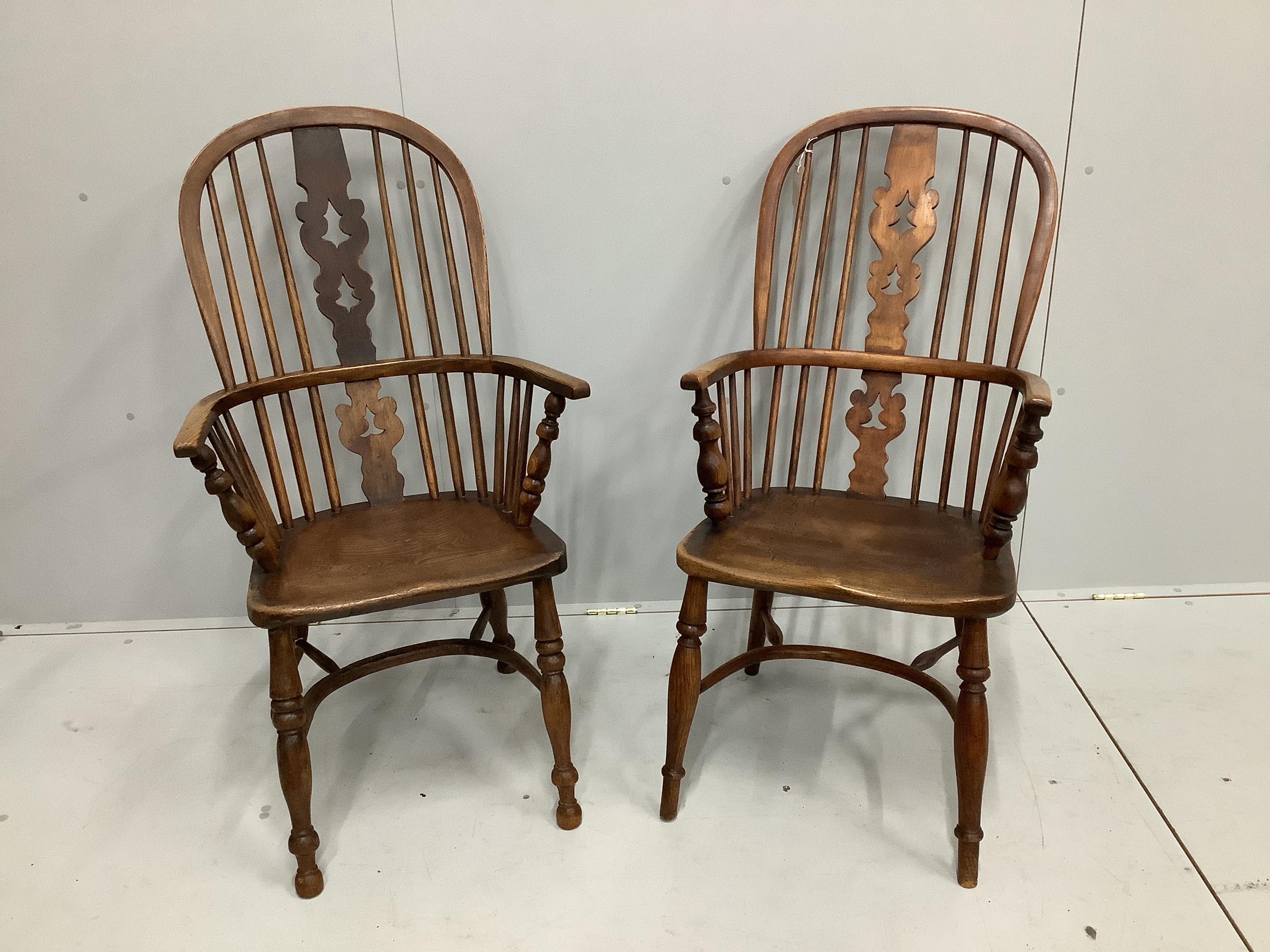 A near pair of mid 19th century Nottingham area ash and elm Windsor armchairs, larger width 53cm, depth 40cm, height 112cm                                                                                                  
