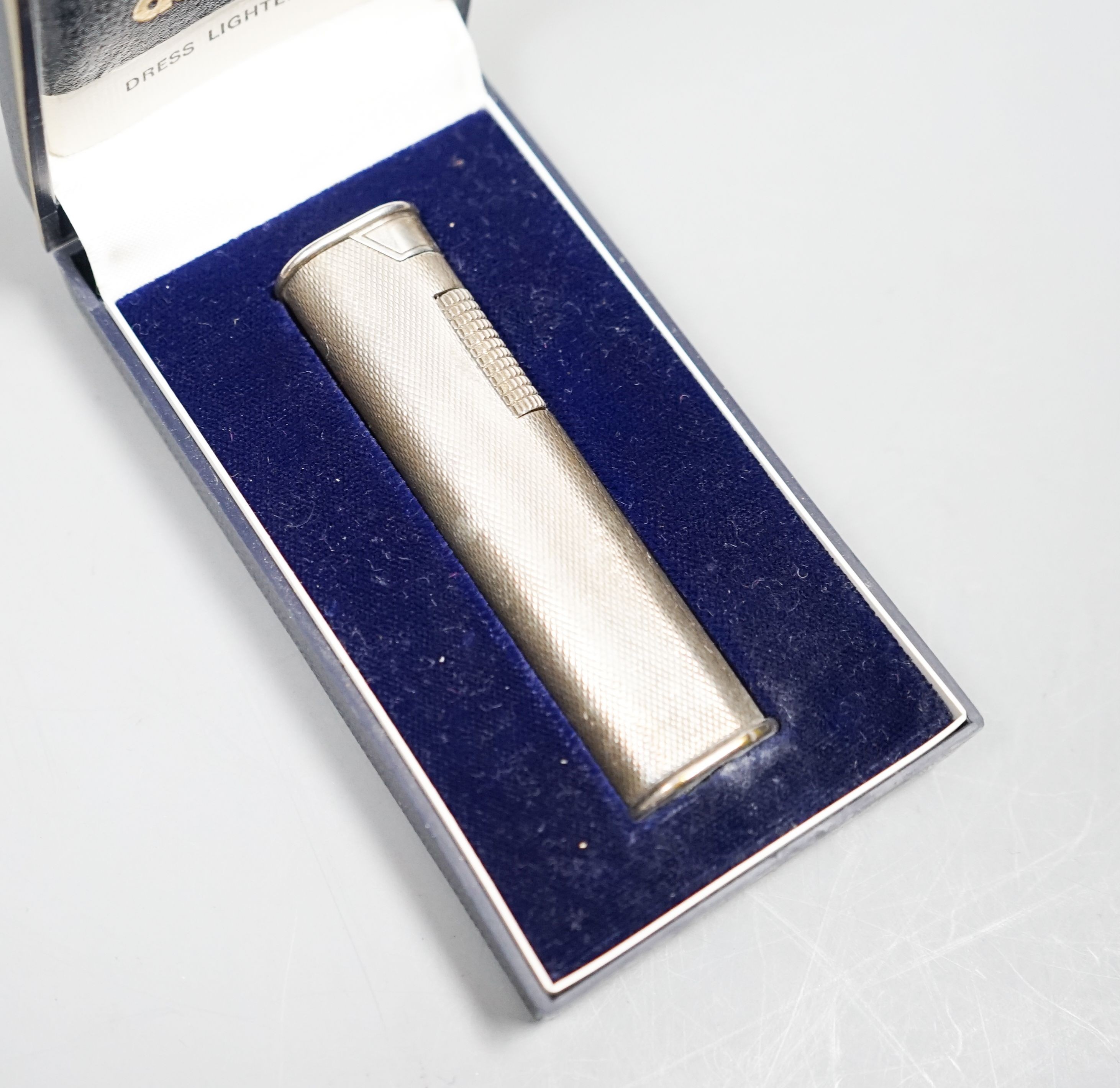 A Dunhill cigarette lighter, in case                                                                                                                                                                                        