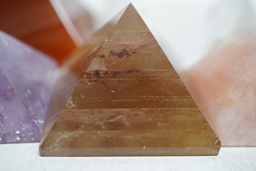 A collection of various carved stone ‘pyramids’ including rose quartz, tallest 4cm. Condition - fair                                                                                                                        