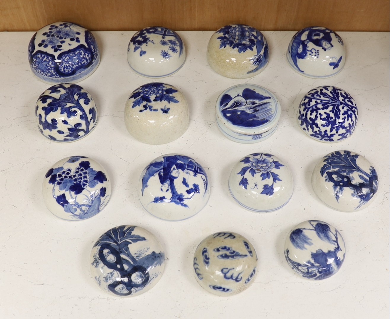 Fifteen 18th/19th century Chinese blue and white jar covers, largest 13.3cm diameter, Provenance - D.C.Monk & Son, former dealers based in Kensington Church Street, London W8                                              