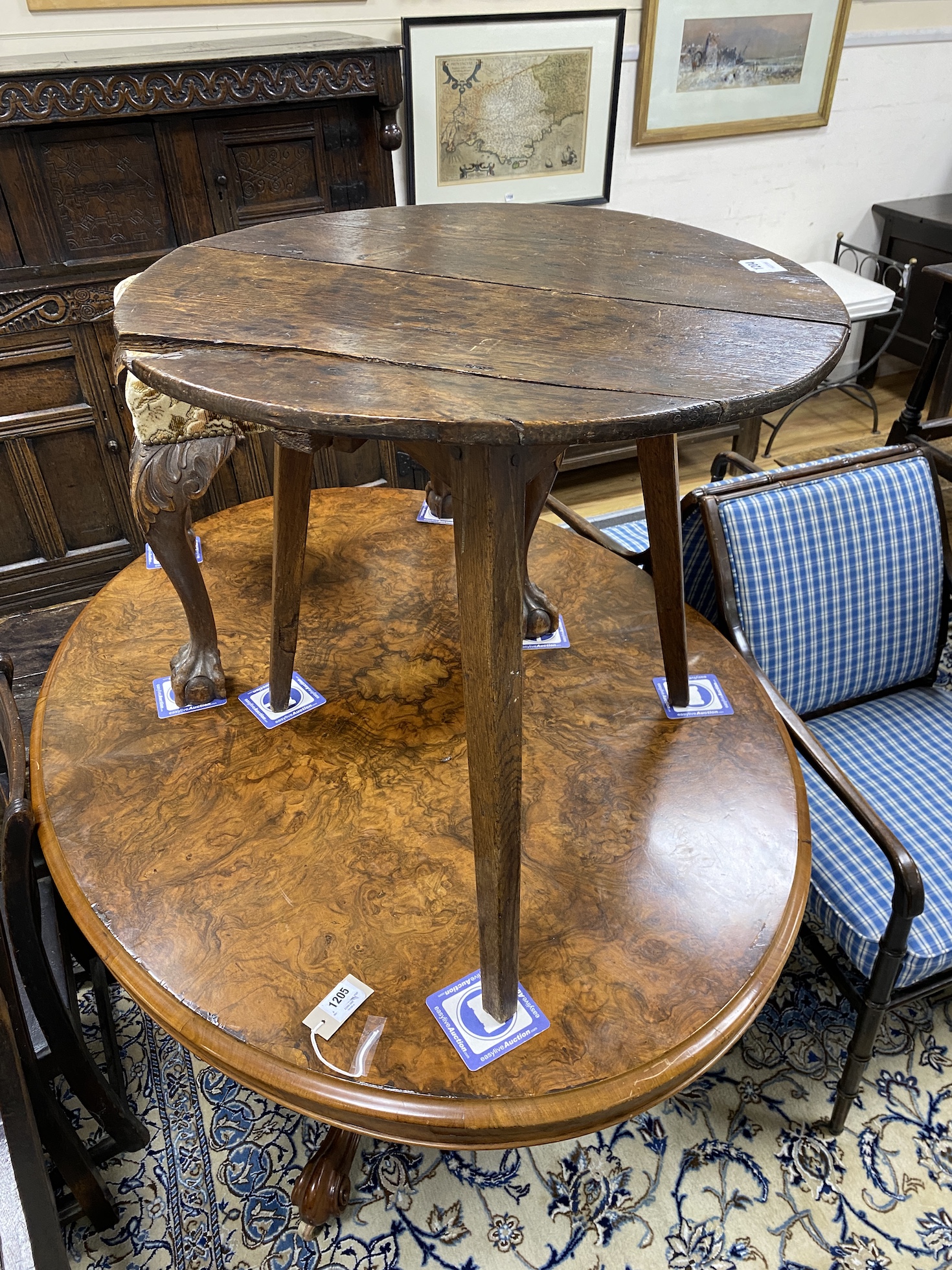 An early 19th century oak and pine cricket table, diameter 64cm, height 63cm                                                                                                                                                