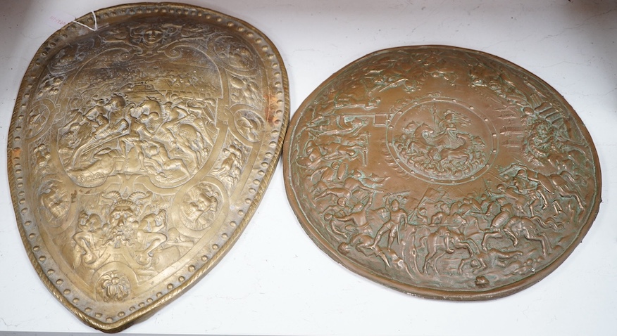 A reproduction bronze casting of the shield of Henry II of France, together with a coppered resin model of another shield, largest 59cm. Condition - fair to good                                                           