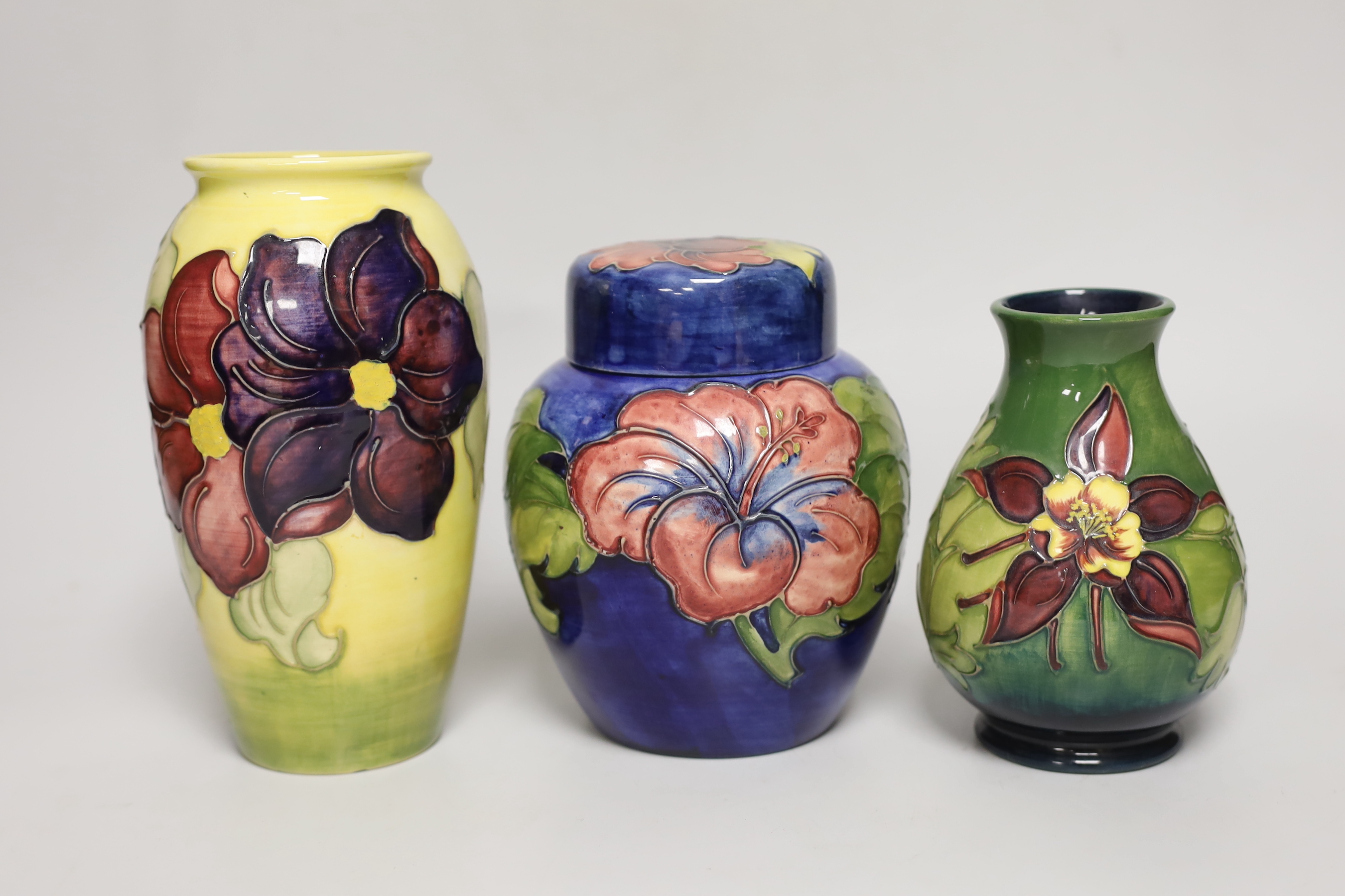 A Moorcroft hibiscus jar and cover, 16cm, an anemone vase and another                                                                                                                                                       