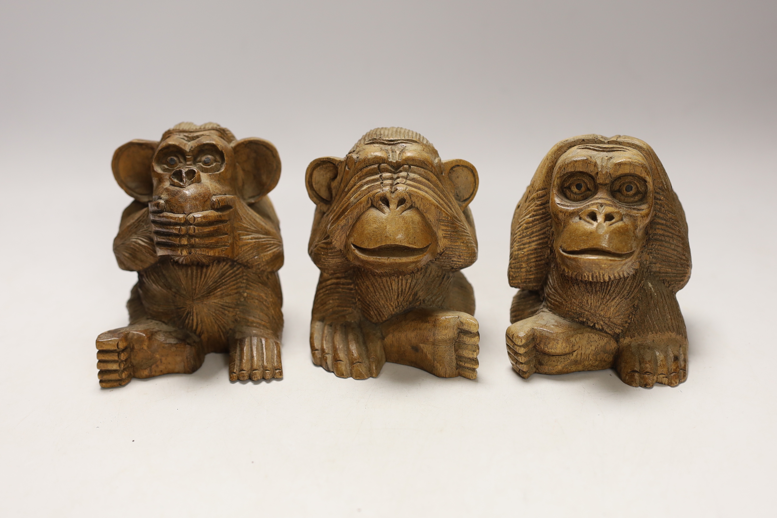 Three carved wood monkeys - hear no evil, see no evil and speak no evil, 10cm tall                                                                                                                                          