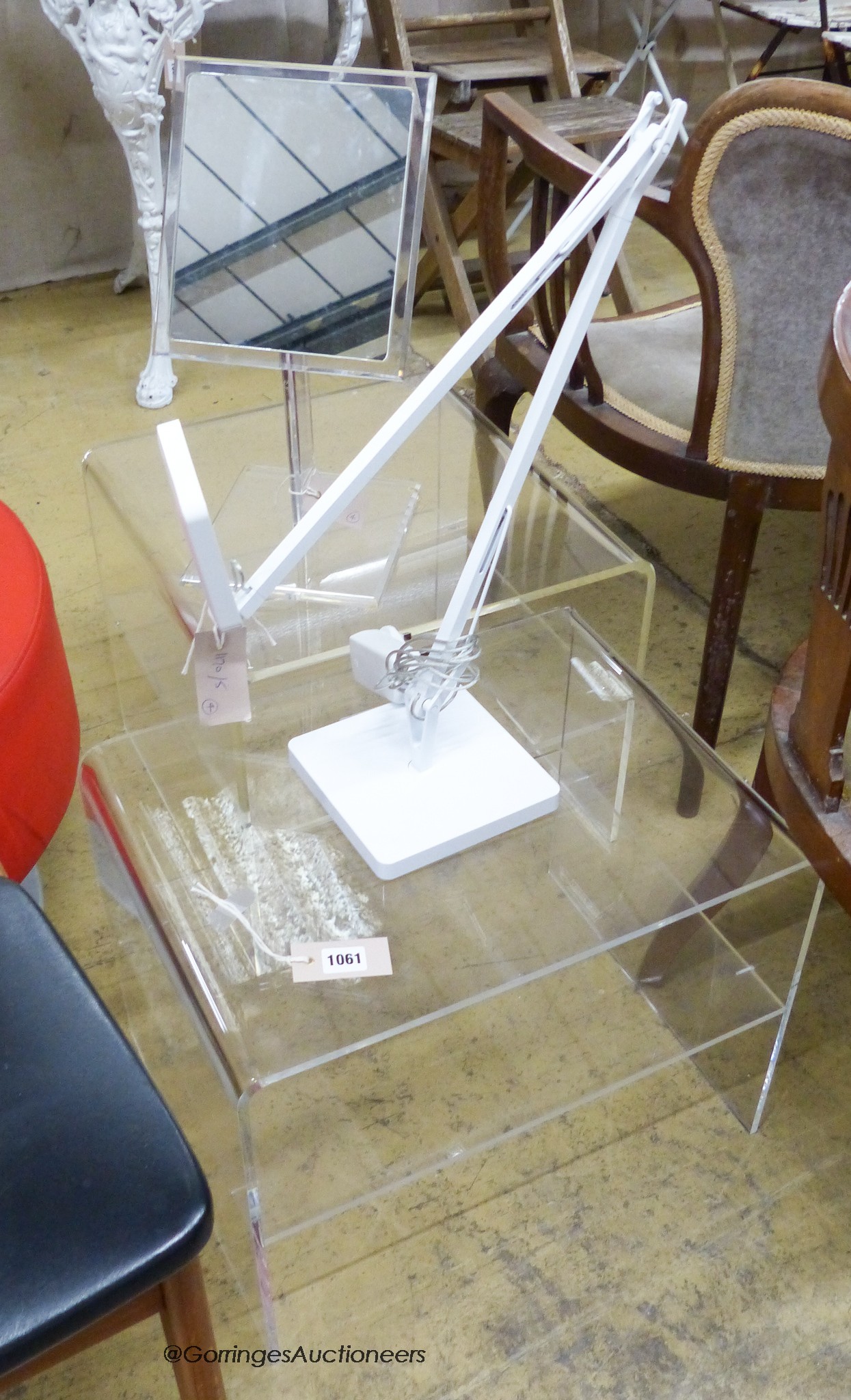 A pair of contemporary Perspex side tables, Perspex shaving mirror and an Italian white angle poise lamp.                                                                                                                   