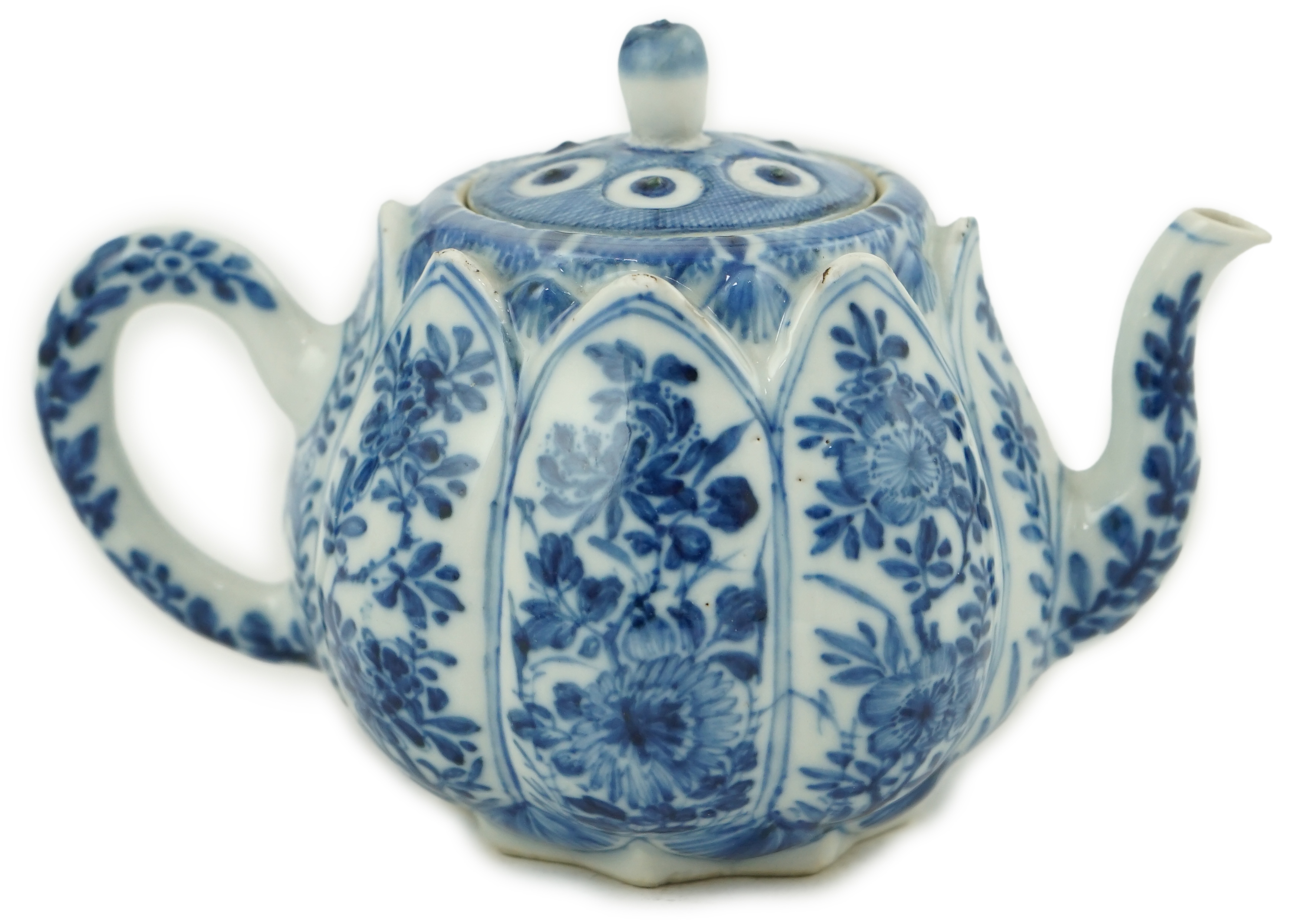 A Chinese blue and white lotus pod-shaped teapot and cover, Kangxi period                                                                                                                                                   