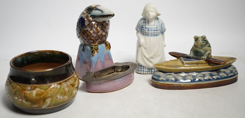 A Doulton Lambeth Kookaburra bibelot with silver tray, a novelty frog in a kayak, a fish jar and figure of a maid, Kookaburra 11cm high. Condition - good                                                                   