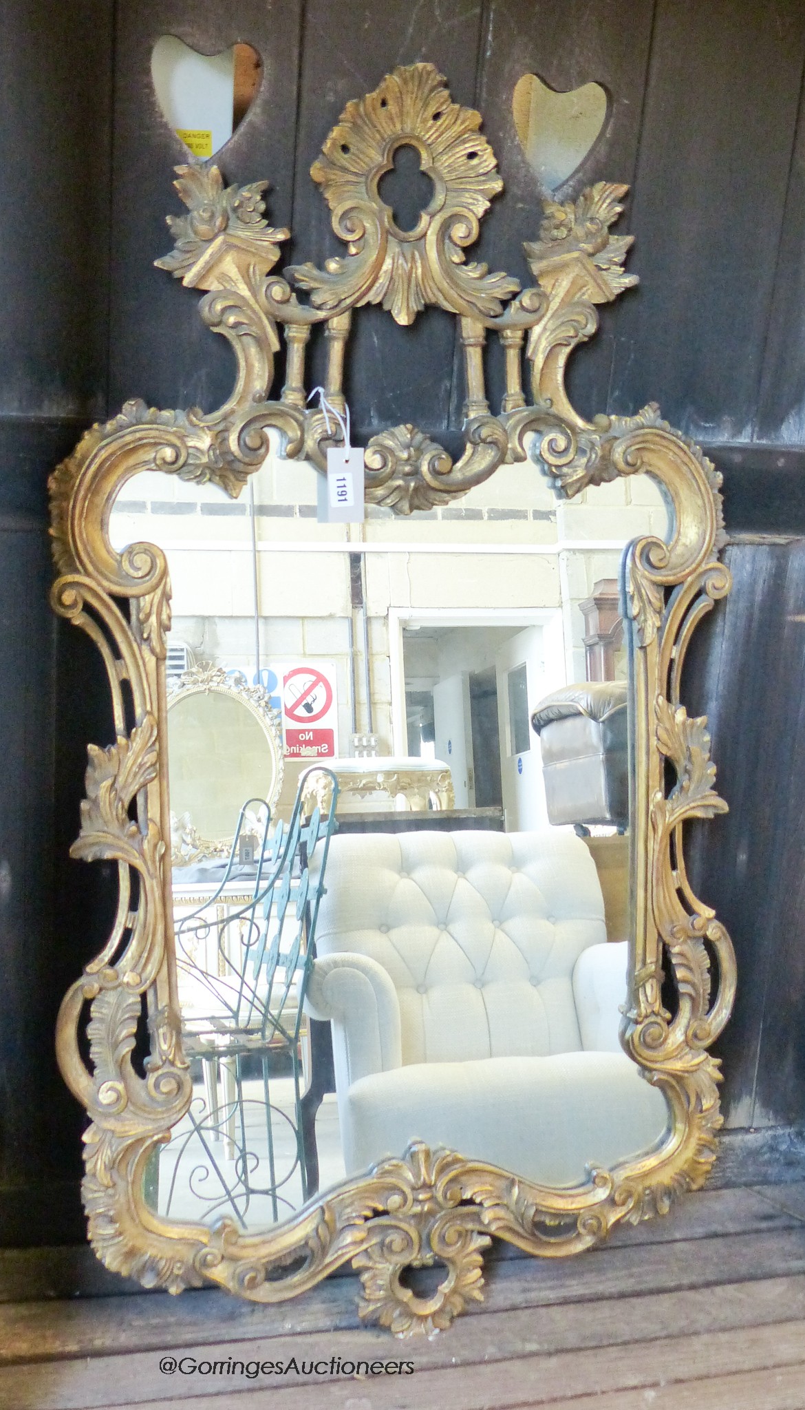 A George III style carved gilt wood mirror. W-70, H-124cm.                                                                                                                                                                  