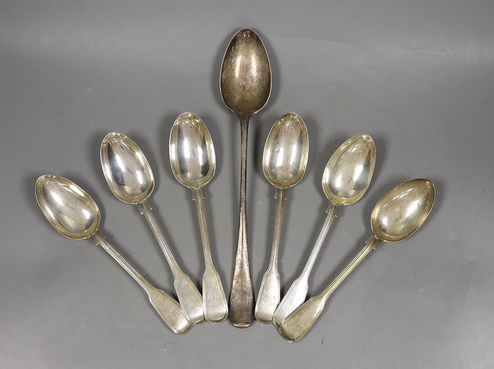 A set of six Victorian silver fiddle and thread pattern table spoons, by George Adams, London, 1864 and a later rat tail pattern basting spoon, Walker & Hall, Sheffield, 1903, 23.2oz.                                     