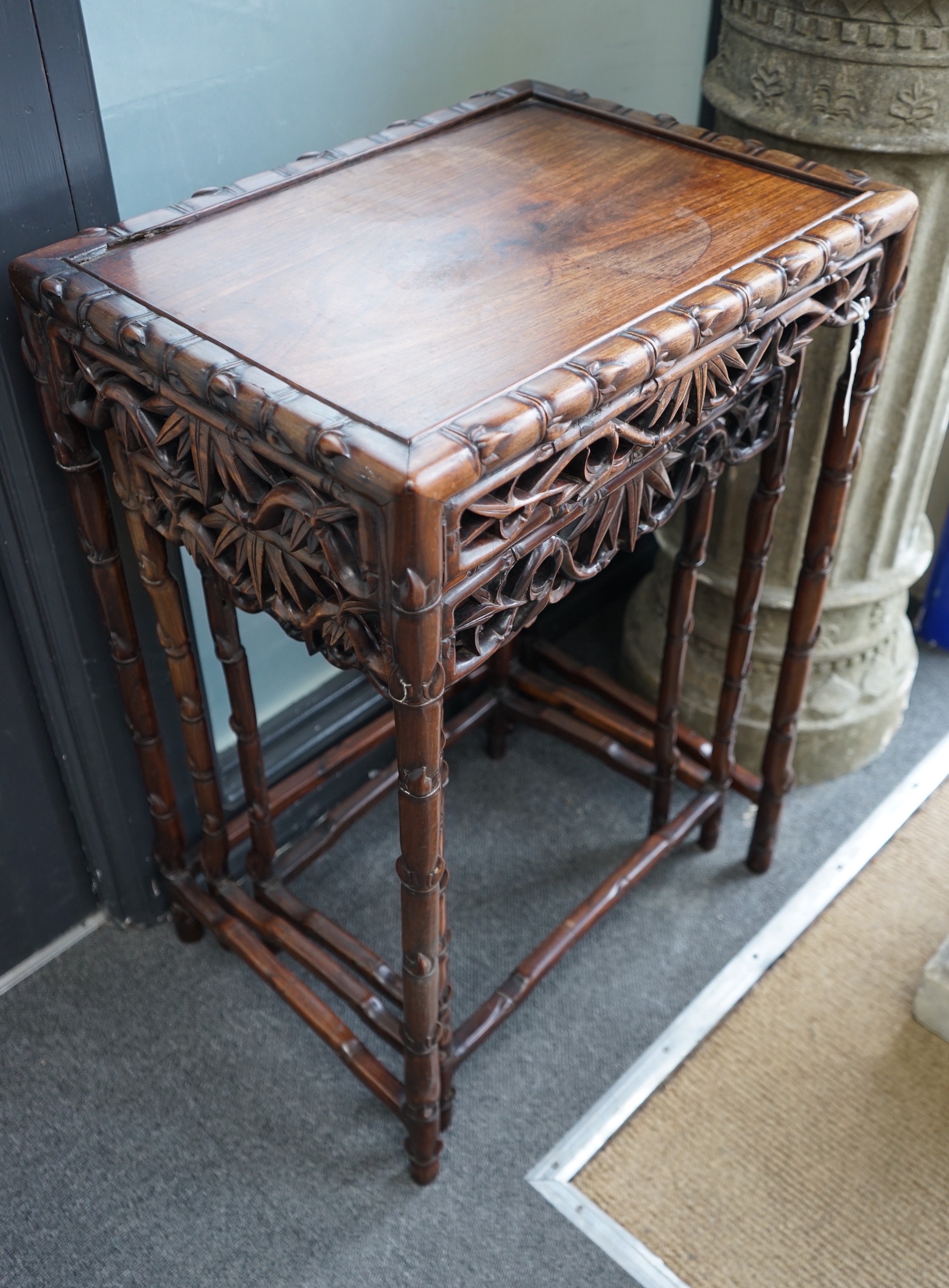 A nest of three Chinese hongmu rectangular tea tables, early 20th century, width 52cm, depth 39cm, height 74cm                                                                                                              