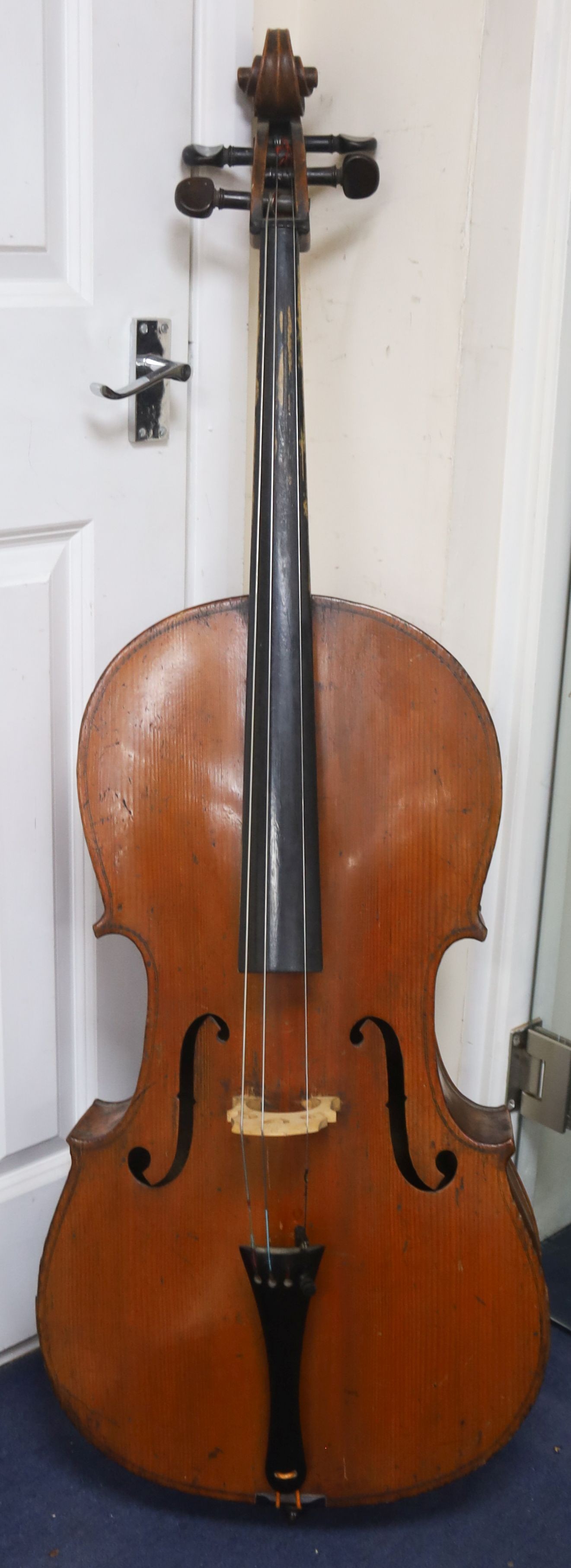 Early 20th century German cello and bow, the back measuring 75cm excluding the button                                                                                                                                       