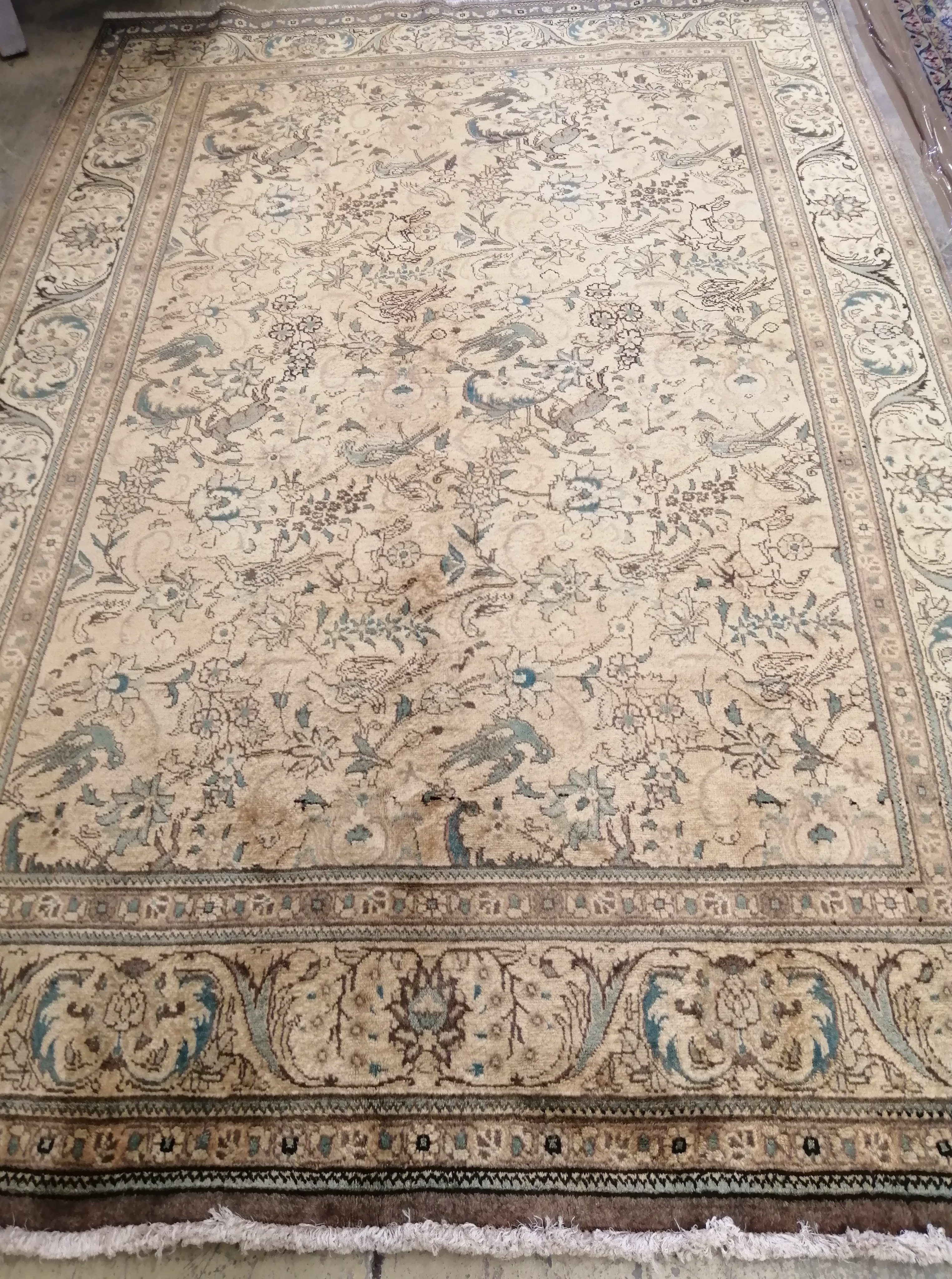 A fine Persian Tabriz gold ground carpet, 290 x 194cm                                                                                                                                                                       