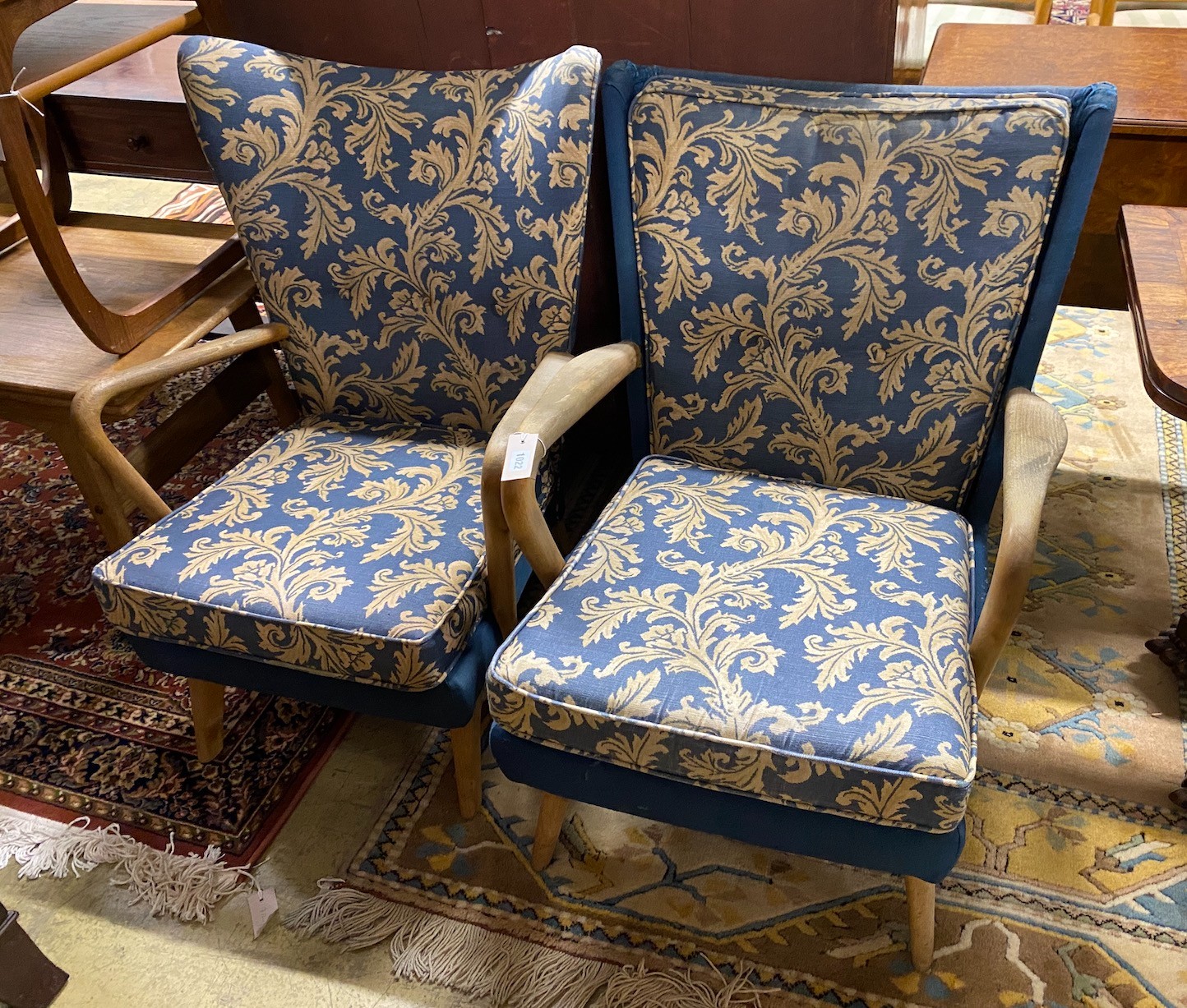 A near pair of mid century Howard Keith 'Bambino' armchairs, larger width 67cm, height 85cm                                                                                                                                 