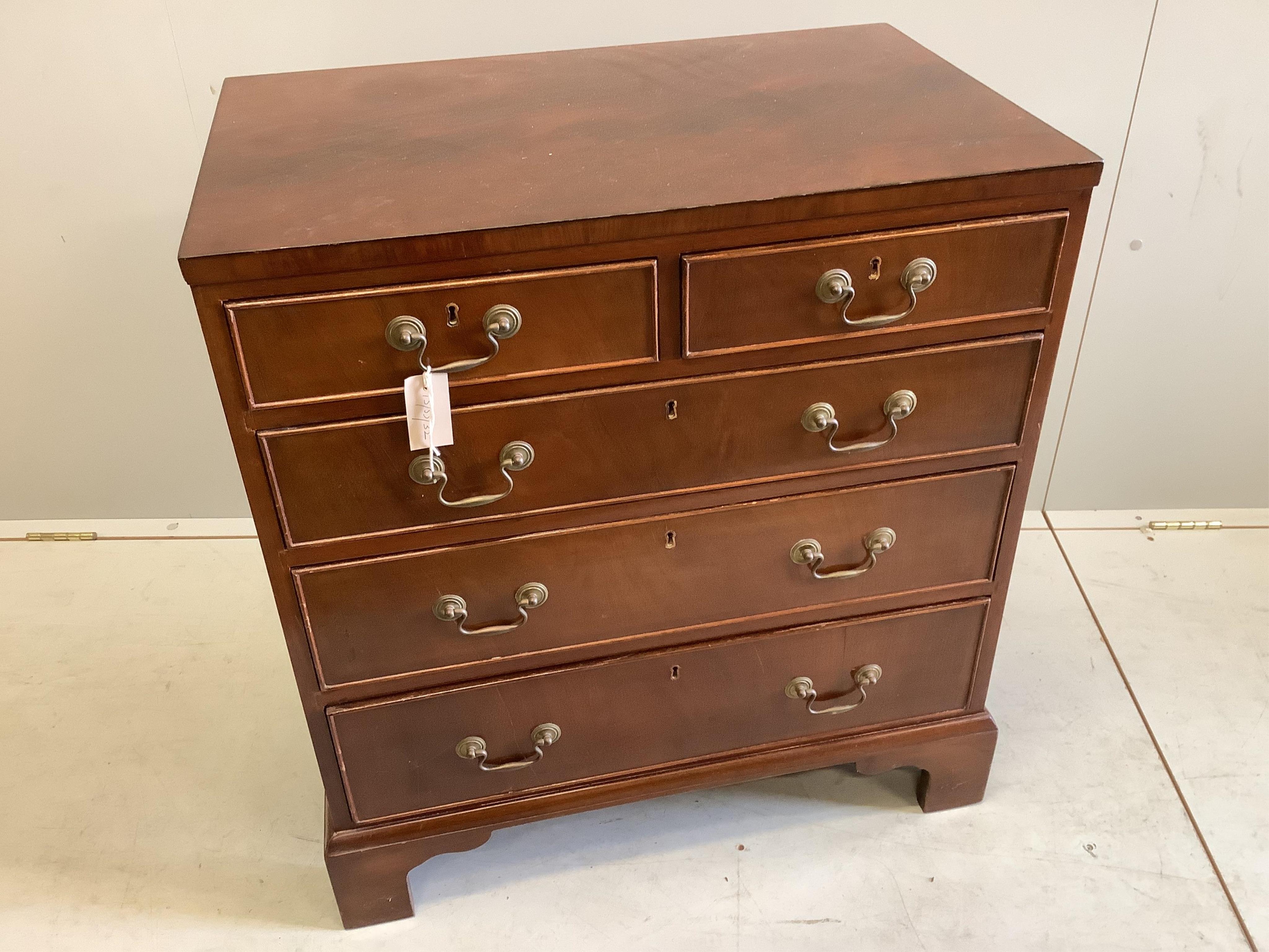 A Georgian style mahogany flush top chest fitted two short and three long drawers, on bracket feet, width 72cm, depth 46cm, height 78cm                                                                                     