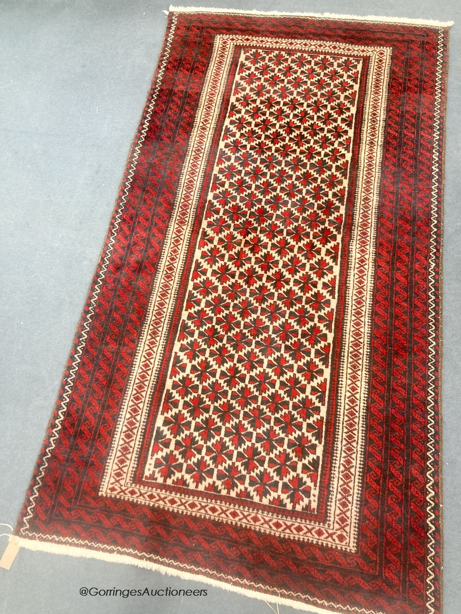 A Belouch wool rug, 194 x 105cm                                                                                                                                                                                             