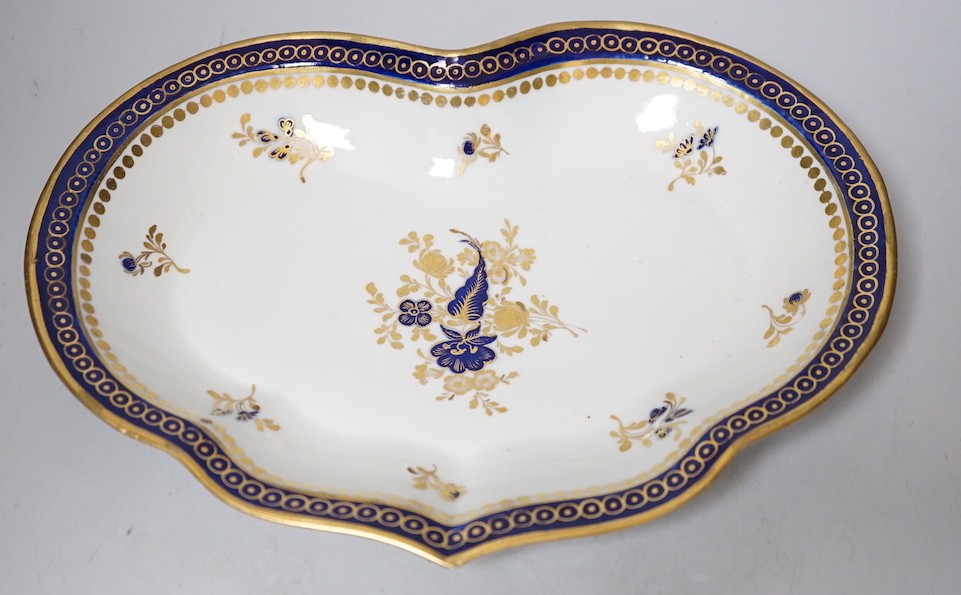 An 18th century Caughley kidney shaped dish with blue and gilt decoration, 28cms wide                                                                                                                                       