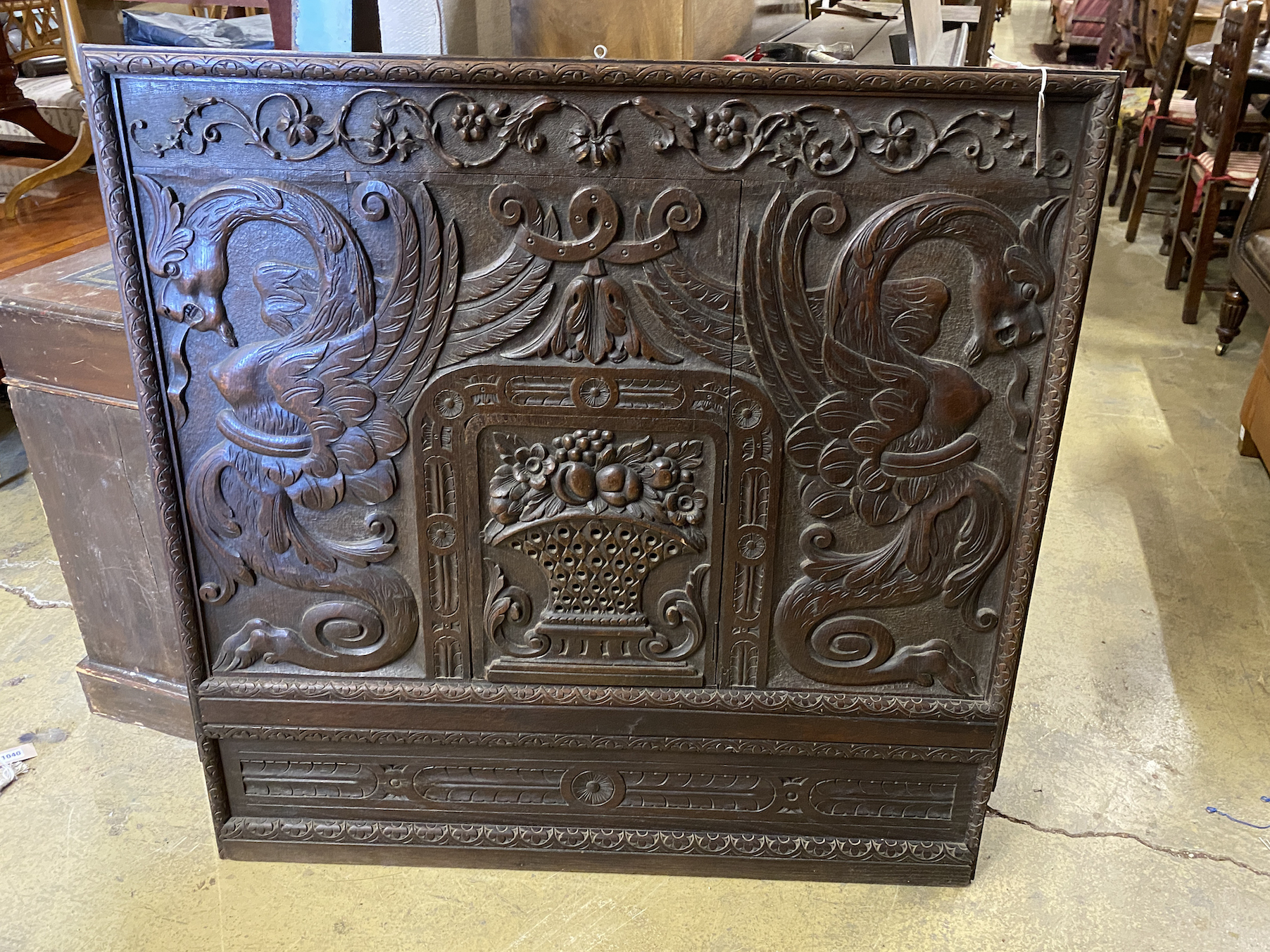 A French carved oak panel, width 104cm, height 103cm                                                                                                                                                                        