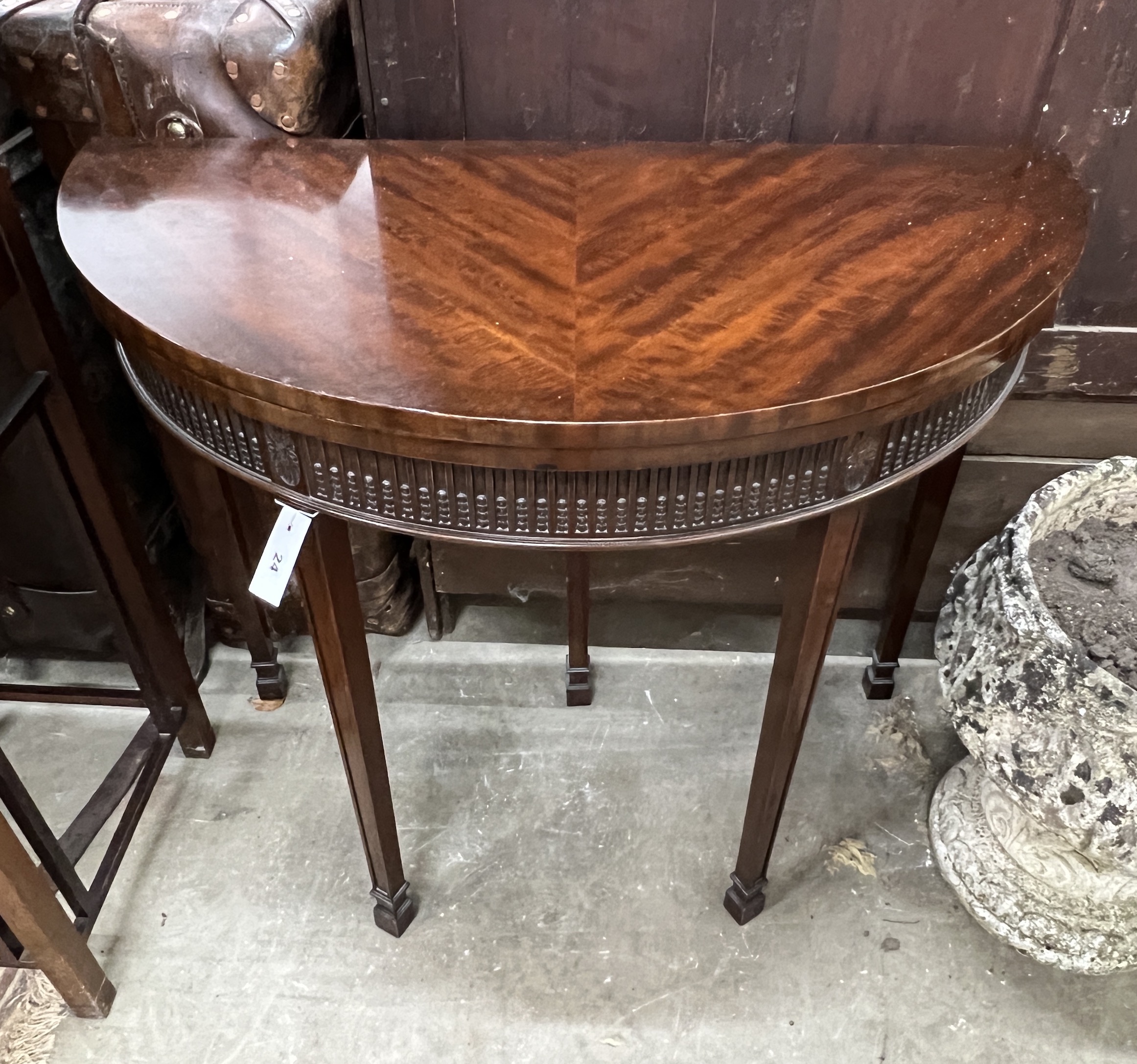 A Chippendale revival mahogany demi lune folding card table, width 92cm, depth 46cm, height 77cm                                                                                                                            