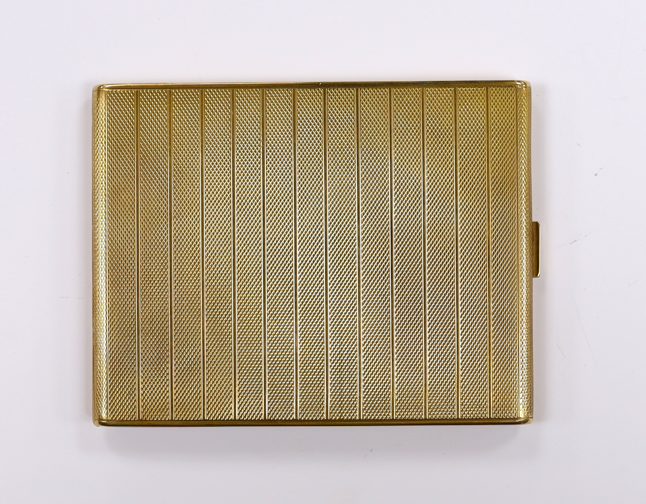 A George V engine turned 9ct gold cigarette case, Chester, 1925, 10.8cm, gross weight 132.7 grams.                                                                                                                          