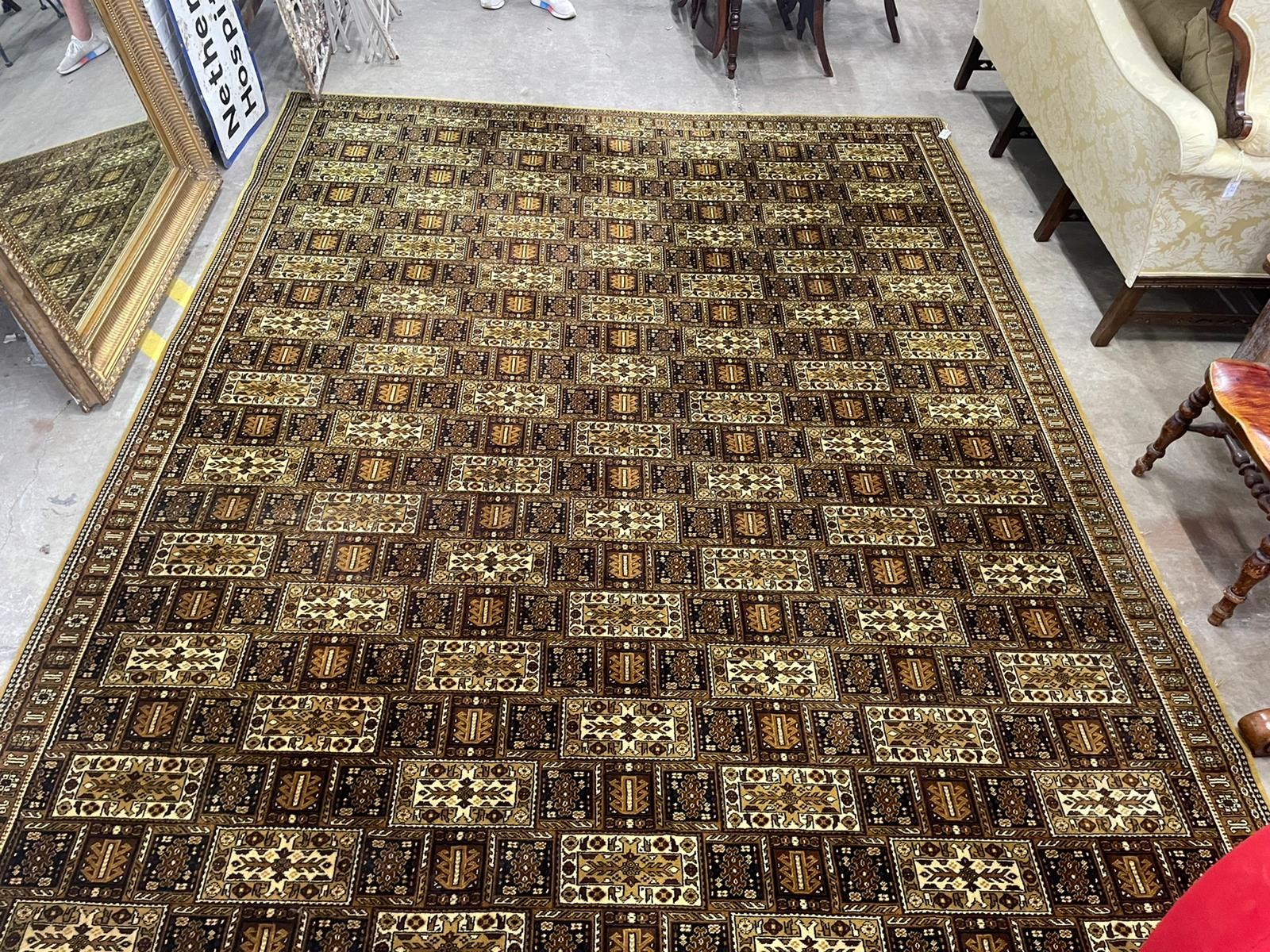 A Wilton machined mustard ground Persian style carpet, 364 x 275cm                                                                                                                                                          