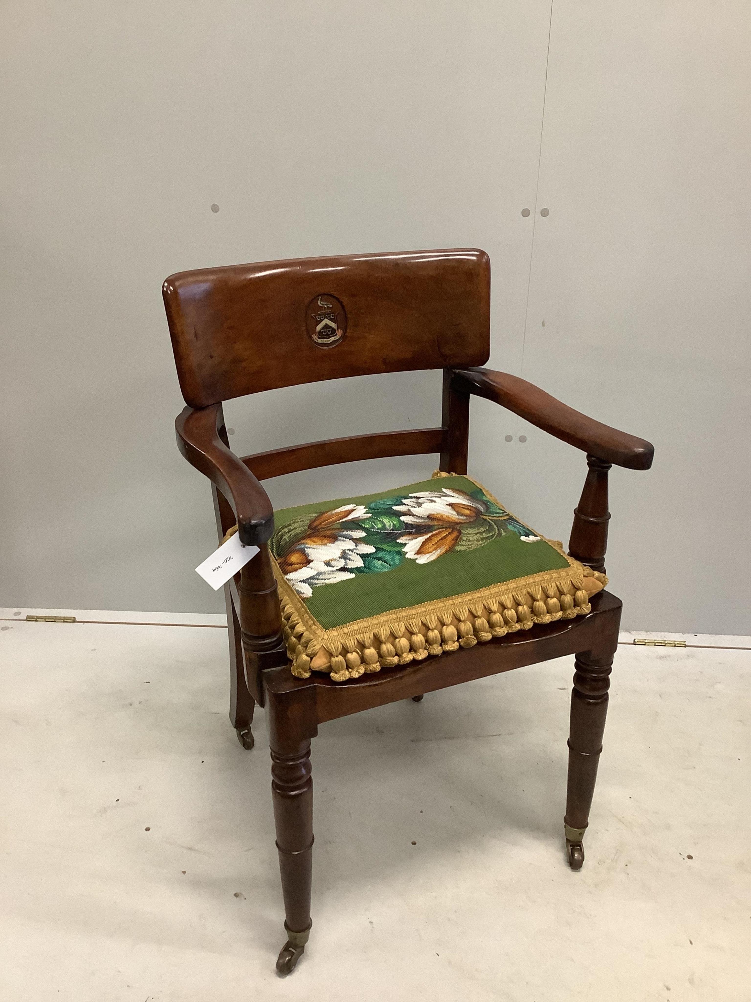 An early 19th century mahogany hall chair with painted armorial and motto 'We Stoop Not', with a Victorian beadwork cushion, width 56cm, depth 42cm, height 88cm. Condition - good                                          