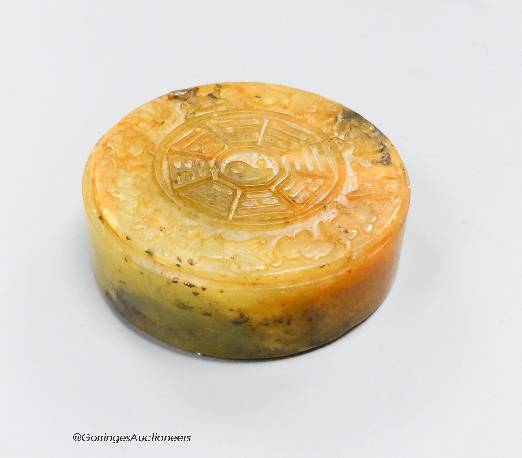 A Chinese soapstone seal disc                                                                                                                                                                                               