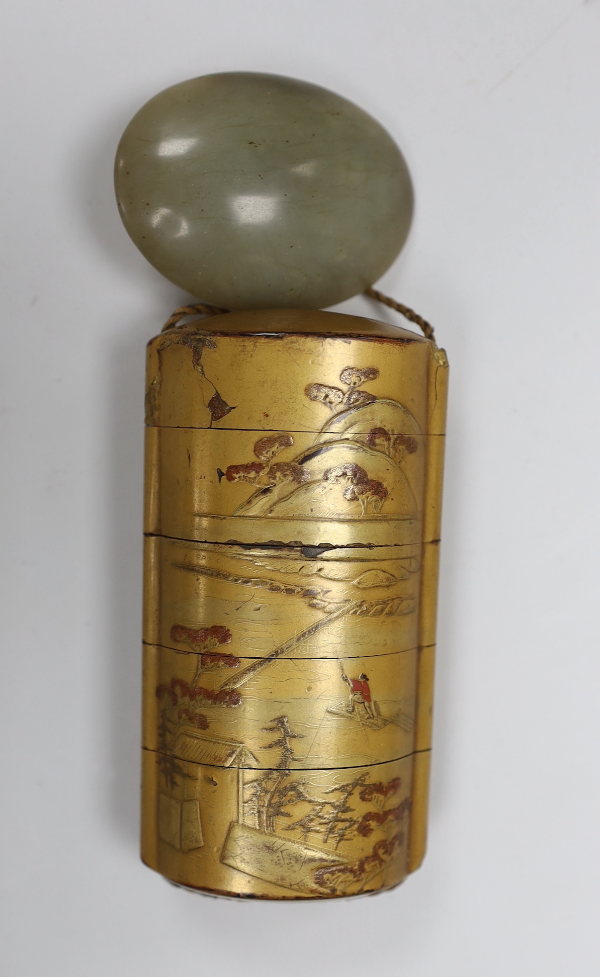 A Japanese four case gilt lacquer inro and a Chinese grey jade toggle                                                                                                                                                       