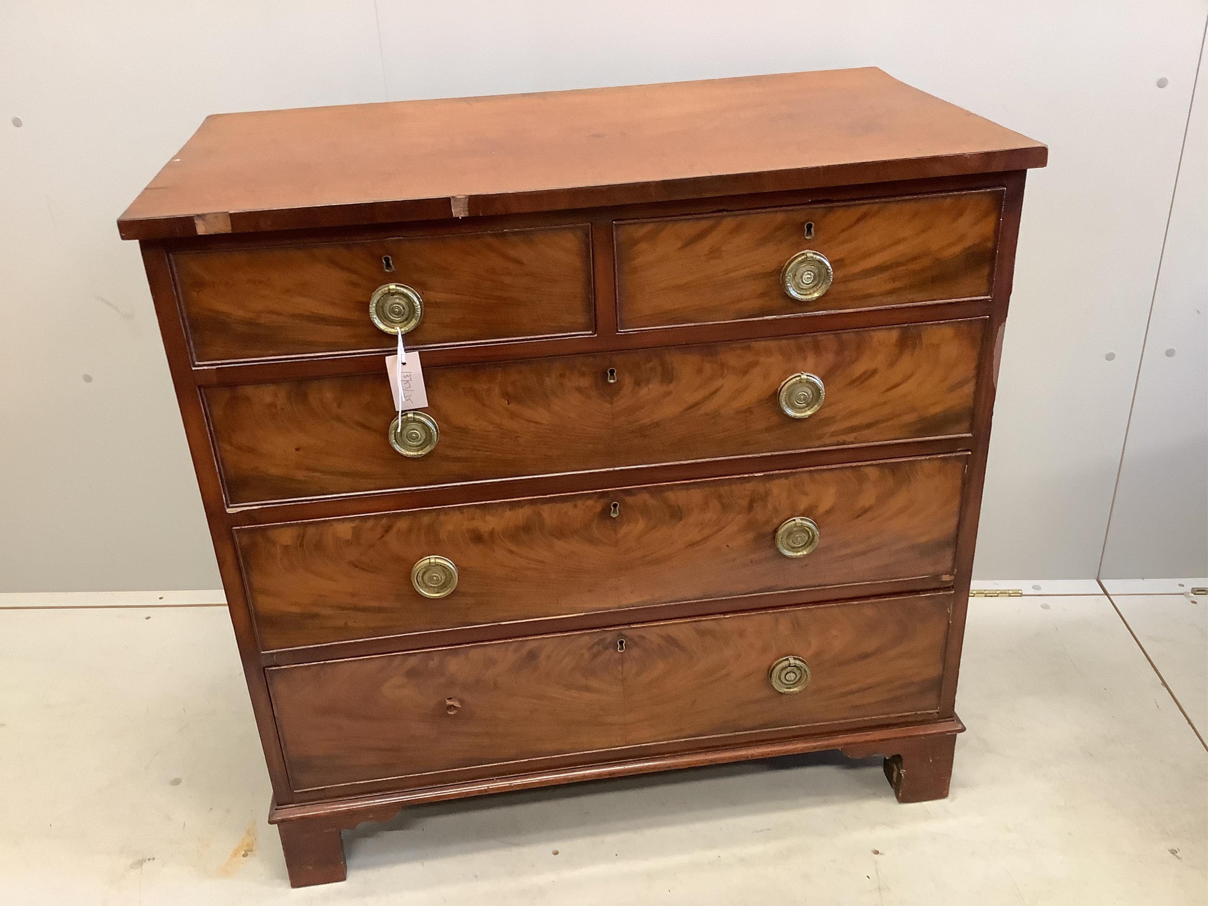 A Georgian mahogany straight front chest of two short and three long drawers, brass ring handles on square bracket feet, width 94cm, depth 50cm, height 92cm                                                                