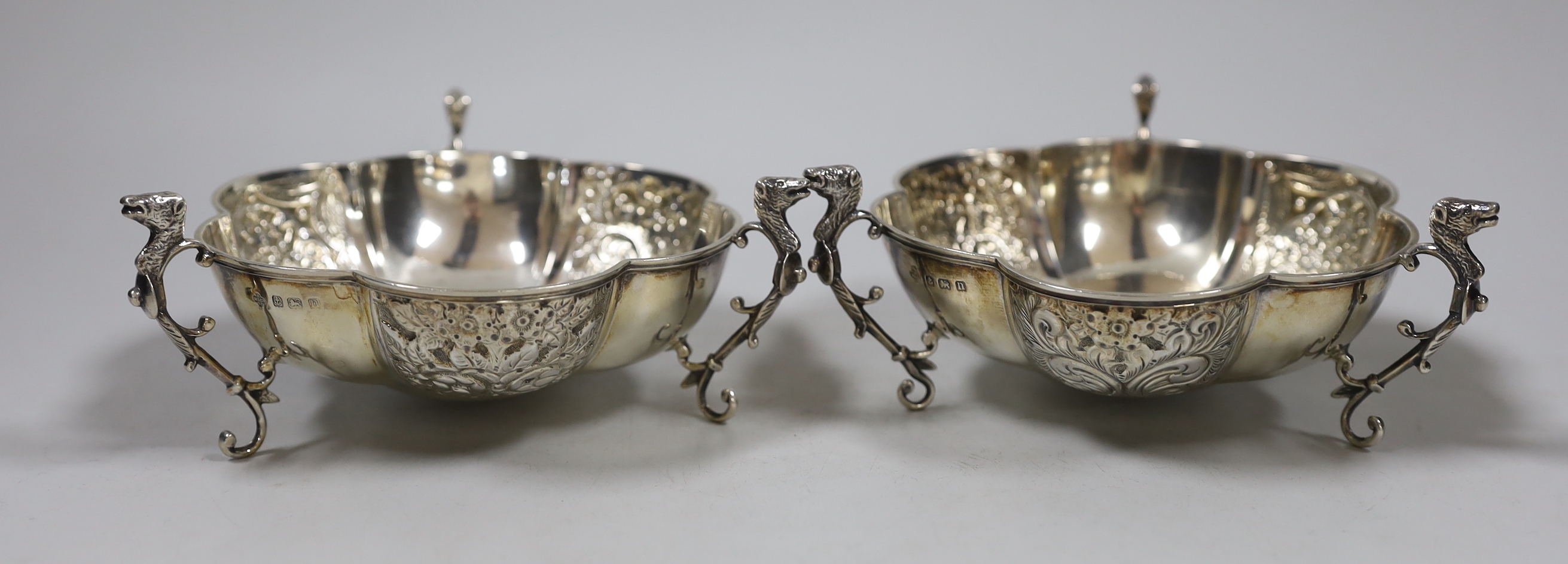 A pair of George V silver tri-handled bonbon dishes, Horace Woodward & Co Ltd, Birmingham, 1912, diameter 12.5cm, 8.4oz.                                                                                                    