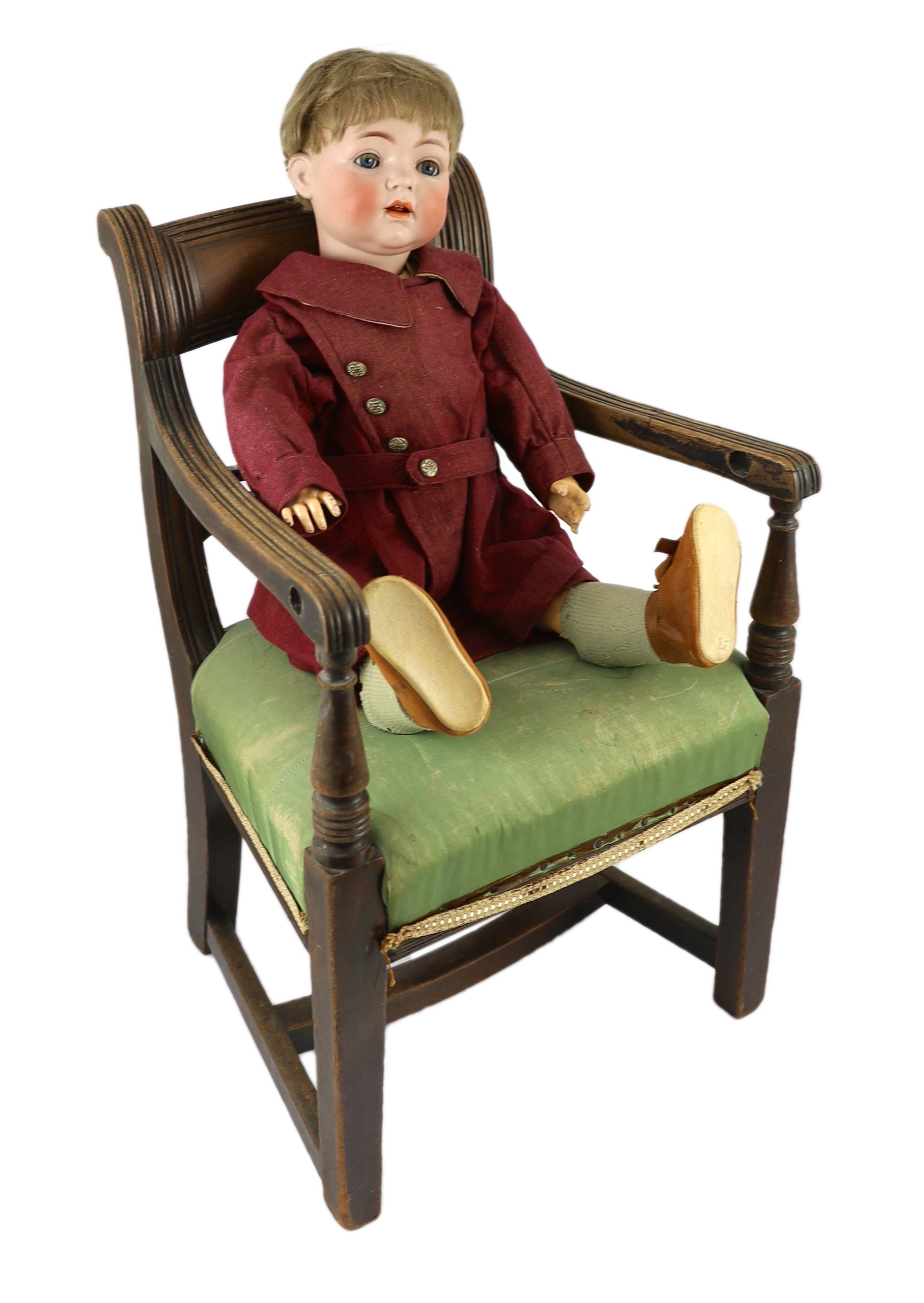 A Kammer & Reinhardt / Simon & Halbig bisque character doll, German, circa 1912, 22in. Please note the chair is for display purposes only.                                                                                  