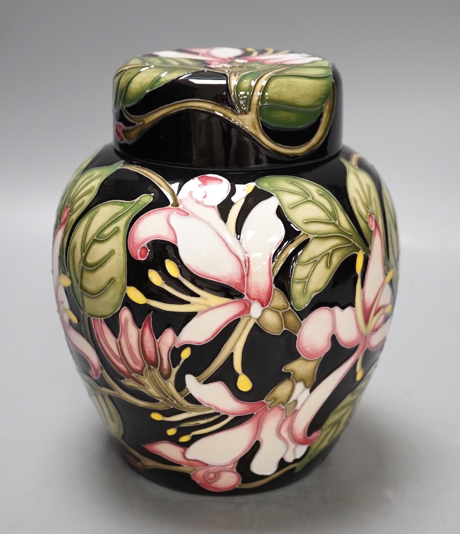 A Moorcroft 'Karzai honeysuckle' jar and cover, by Kerry Goodwin, numbered edition 769/6, 2012, boxed, 15 cms high.                                                                                                         