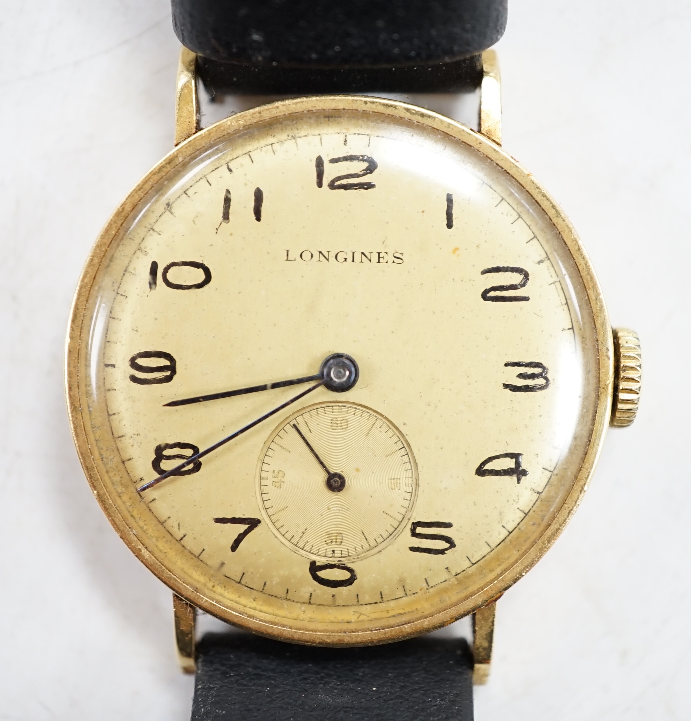 A Longines gentleman's 18ct gold wrist watch, with subsidiary seconds. Condition - appears to run, gauging to side, otherwise fair                                                                                          