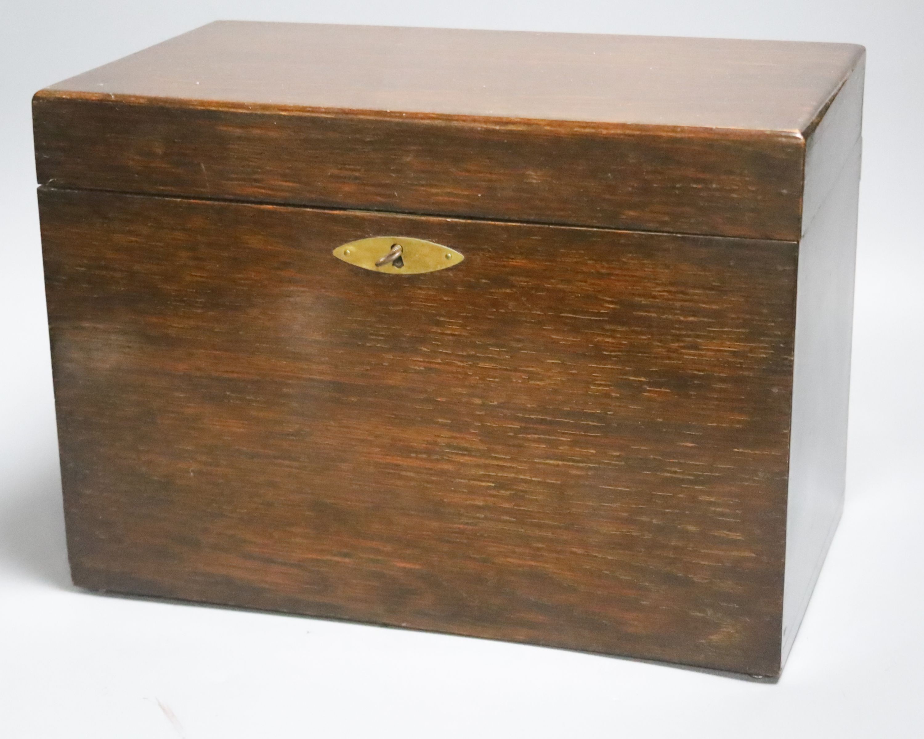 A Whitmore & Bayley oak cigar box and cigars, 1920s, some tubes empty                                                                                                                                                       