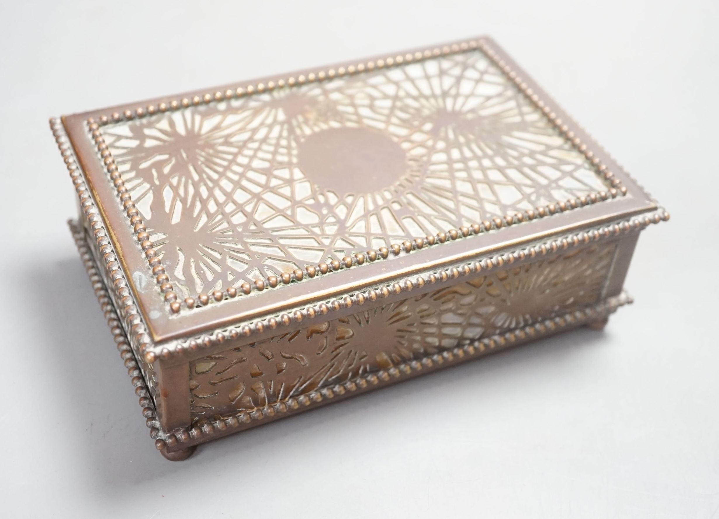 A Tiffany Studios box, pine needles pattern, 15 cms wide x 5cms high.                                                                                                                                                       