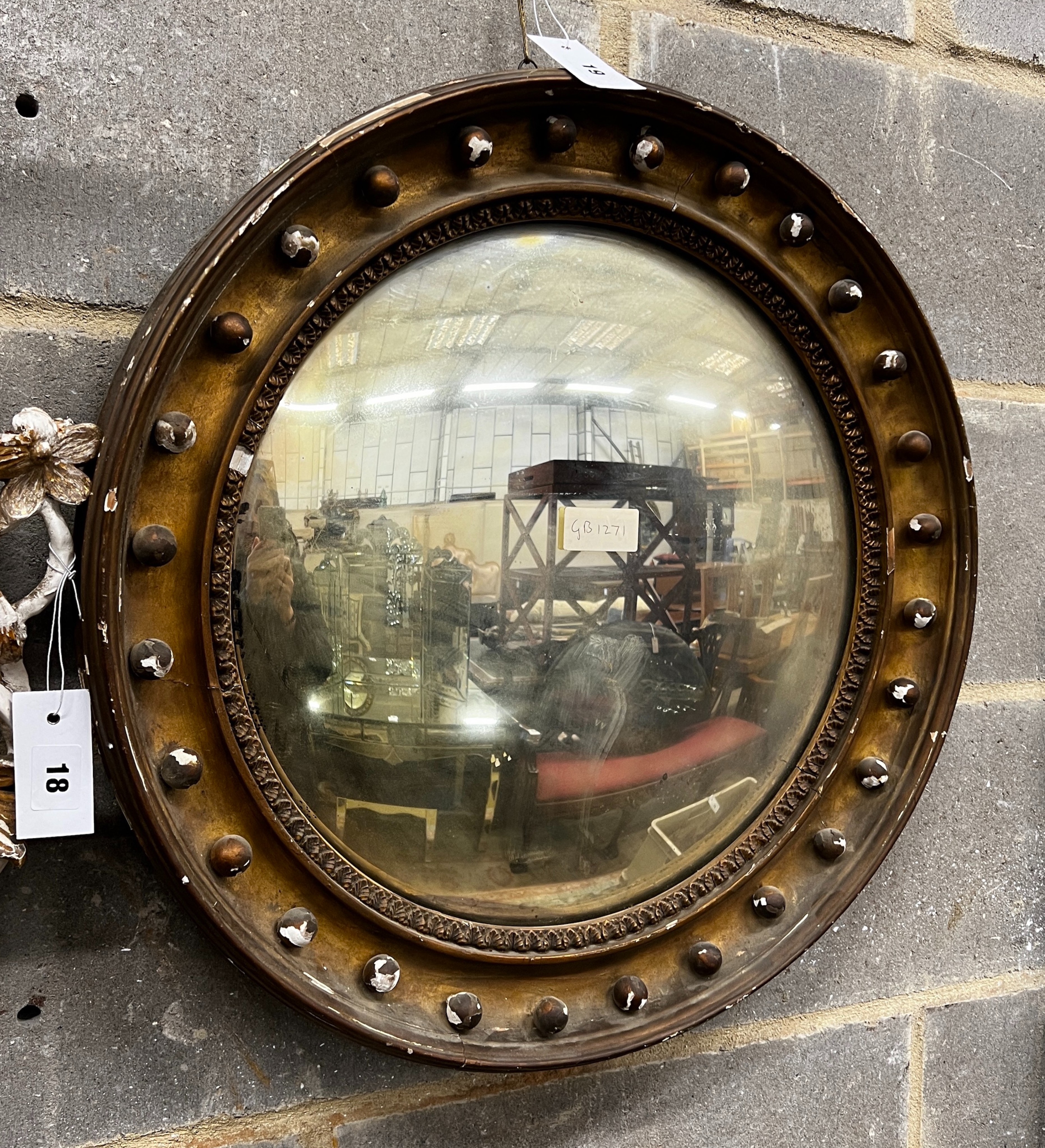 A Regency giltwood convex wall mirror in need of repair, diameter 56cm                                                                                                                                                      