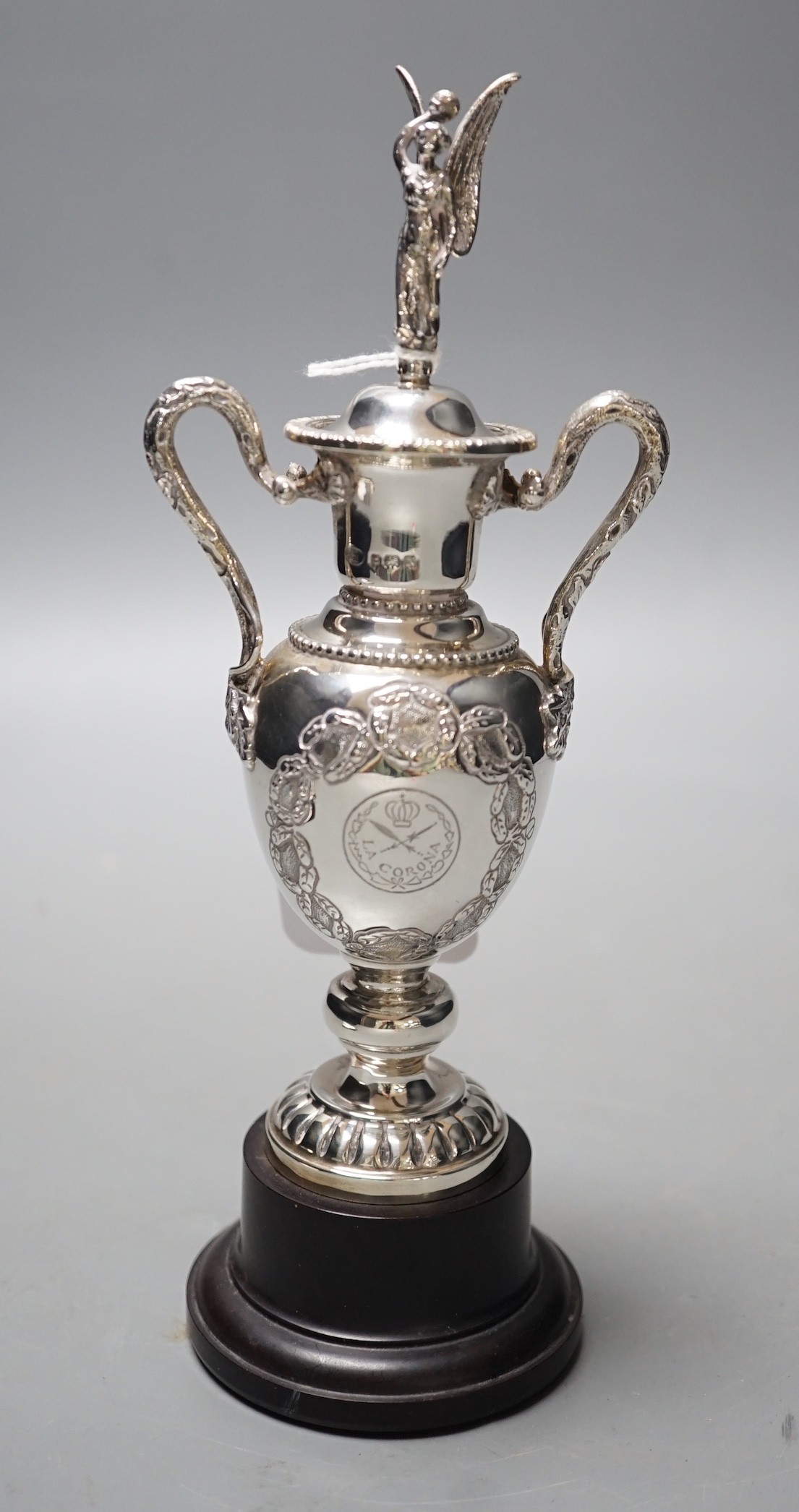 A George VI silver two handled golfing related presentation trophy cup and cover, Alexander Clark Co. Ltd, Birmingham, 1937, 18.3cm, 4.9oz, on wooden socle.                                                                