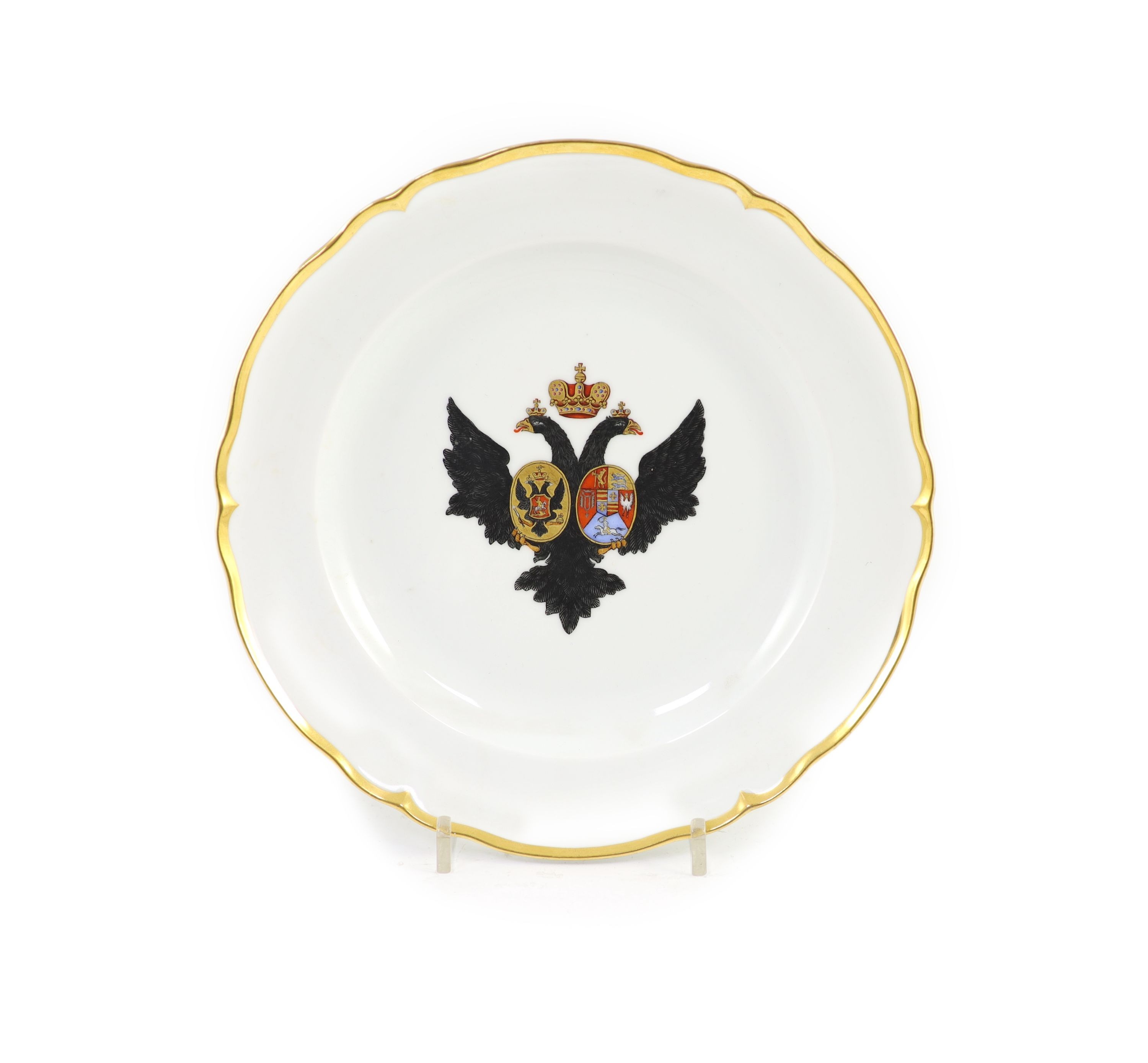 A Russian porcelain armorial plate, Imperial Porcelain Factory, St. Petersburg, Period of Alexander II, (ruled 1856-81), 24.8 cm diameter                                                                                   