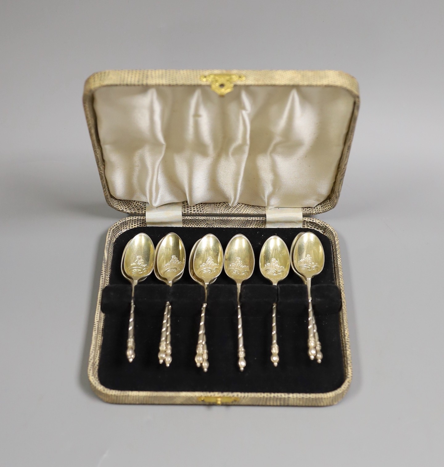 A set of ten Victorian chased silver tea spoons, by George Adams, London, 1874, 135 grams.                                                                                                                                  
