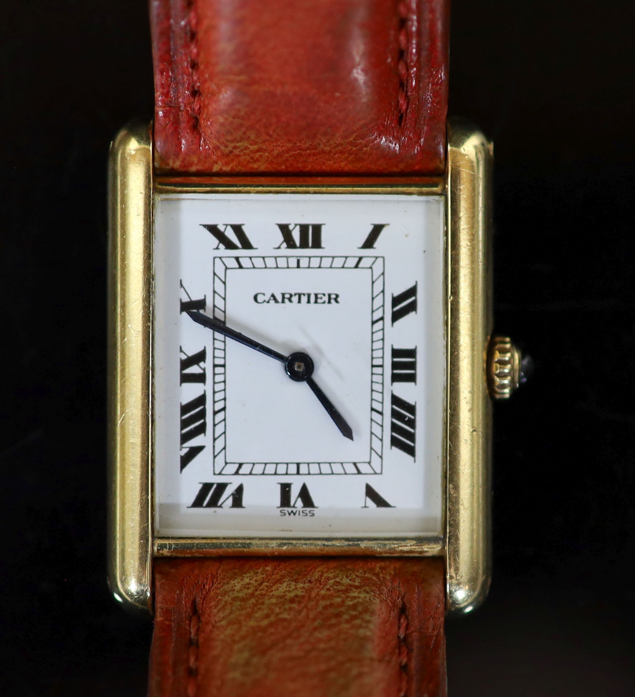 A lady's 18ct gold Cartier Tank Louis quartz wrist watch, on a leather strap                                                                                                                                                